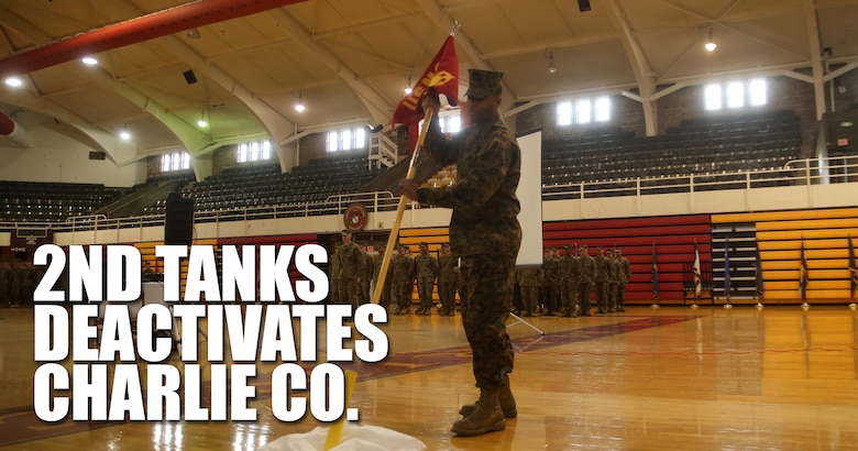 Gunnery Sgt. Derrick A. Jackson, the Charlie Company first sergeant with 2nd Tank Battalion, retires the company guidon during Charlie Company’s deactivation ceremony at Camp Lejeune, N.C., March 4, 2016. Charlie Company, activated in 1941, has taken part in some of the America’s largest battles to include World War II (Tarawa, Saipan), The Vietnam War, Operations Desert Storm and Shield, and Operation Iraqi Freedom (Fallujah).(U.S. Marine Corps illustration by Cpl. Joey Mendez)