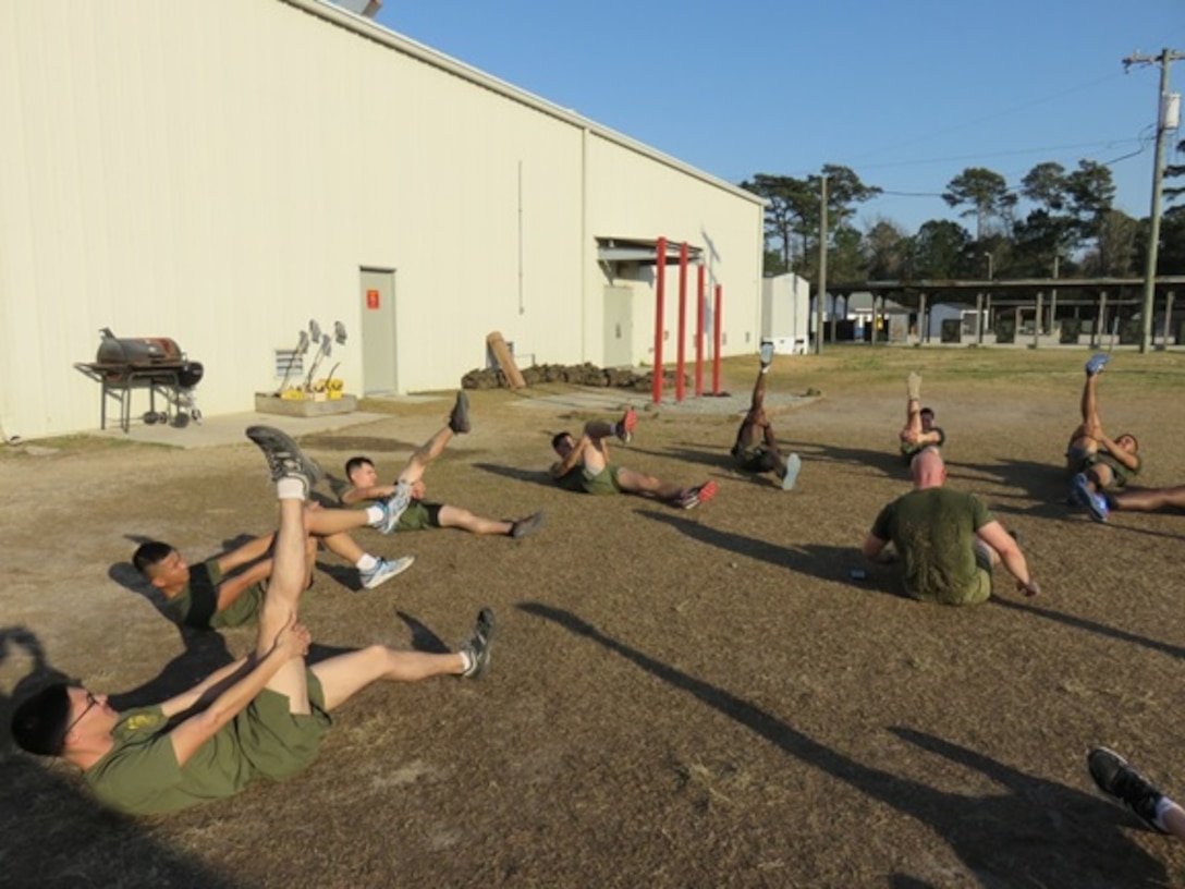 Marines attending Advanced Water Support Technician course 2-16 (AWST 2-16) at Courthouse Bay, Camp Lejeune, N.C. conduct stretching exercises before physical training at Camp Sweat. Physical training not only maintains the Marines' level of physical fitness but also builds camaraderie and espirit de corps.

 