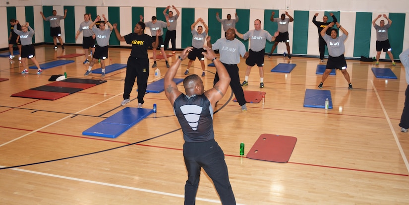 David Durham conducts a full body boot camp during the 80th Training Command health and fitness training event for individuals with body weight and Army Physical Fitness Test challenges at the command headquarters, Richmond, Va., March 5, 2016.
