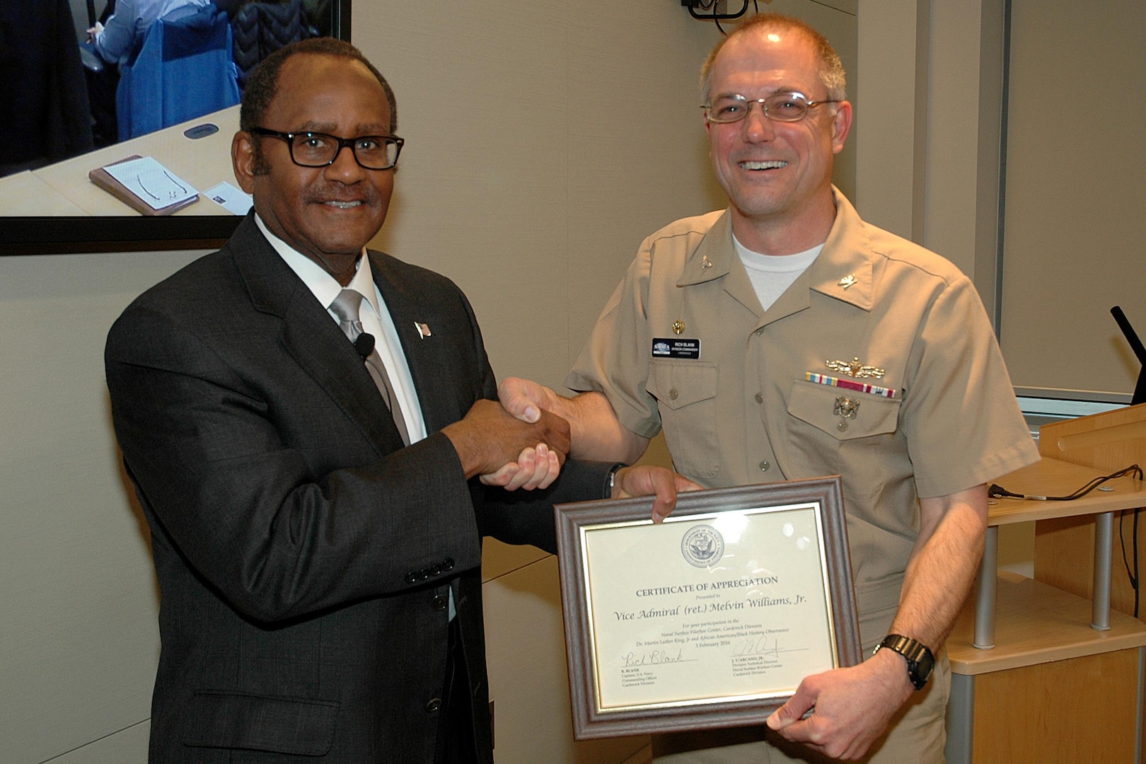 Retired Vice Adm. Melvin Williams Jr. receives a certificate of appreciation from Naval Surface Warfare Center, Carderock Division Commanding Officer Capt. Rich Blank for speaking at the command's Martin Luther King Jr. Day/African American History Month observance in West Bethesda, Md., Feb. 3, 2016. (U.S. Navy photo by Harry Friedman/Released)