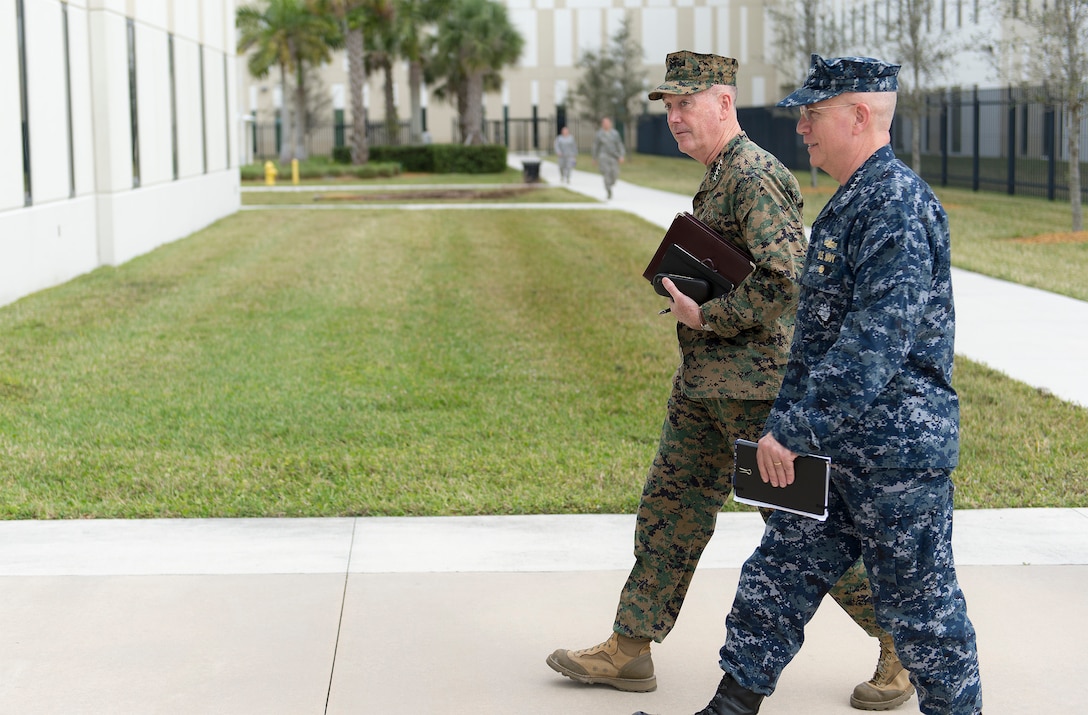 Marine Corps Gen. Joseph F. Dunford Jr., left, chairman of the Joint Chiefs of Staff, walks with Navy Adm. Kurt W. Tidd, commander, U.S. Southern Command, at the command's headquarters in Miami, March, 8, 2016. DoD photo by Navy Petty Officer 2nd Class Dominique A. Pineiro