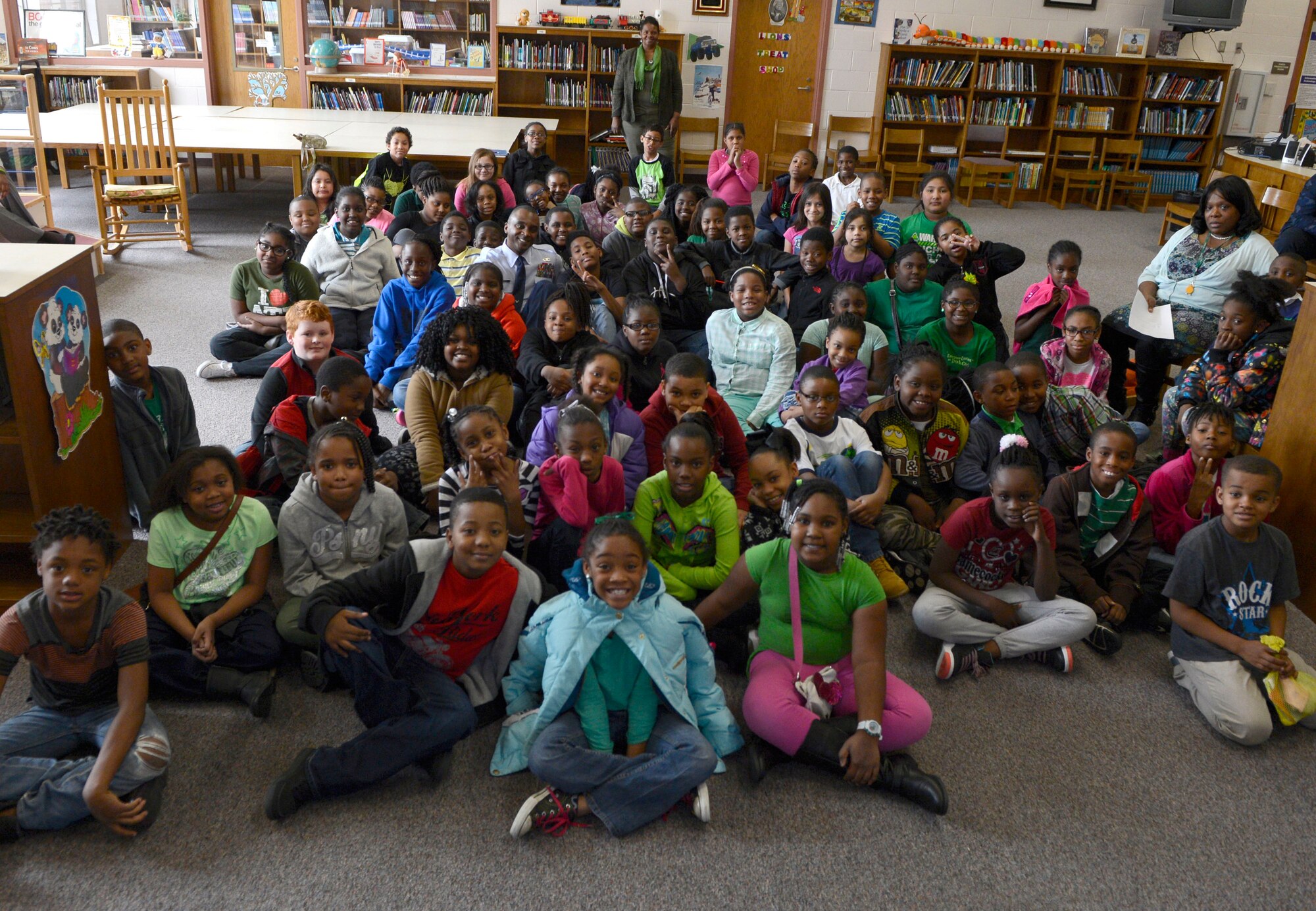 Rafting Creek Elementary School students sit with U.S. Air Force Chief Master Sgt. Christopher McKinney, 20th Fighter Wing command chief, after listening to him speak March 1, 2016. McKinney plans to visit the school each month to stengthen his relationships and mentor the students. (U.S. Air Force photo by Senior Airman Jensen Stidham)