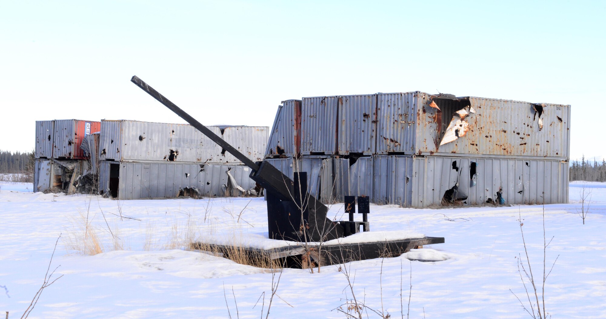 Shipping containers make up mock targets on the Oklahoma Range, March 2, 2016, in Delta Junction, Alaska. These targets are used by pilots during RED FLAG-Alaska for strategic training and are set-up and torn-down by 354th Civil Engineer Squadron range maintenance Airmen. (U.S. Air Force photo by Airman 1st Class Cassandra Whitman/Released) 