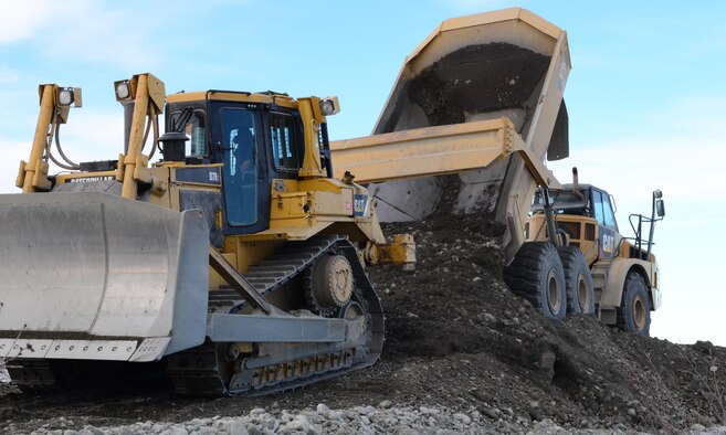 A rock truck operated by a 354th Civil Engineer Squadron “dirt boy” dumps dirt to make a trail system March 2, 2016, in Delta Junction, Alaska. The 354th CES “dirt boyz” and structural craftsman Airmen work for approximately 38 days to prepare the Oklahoma Range for RED FLAG-Alaska’s strategic training mission. (U.S. Air Force photo by Airman 1st Class Cassandra Whitman/Released)