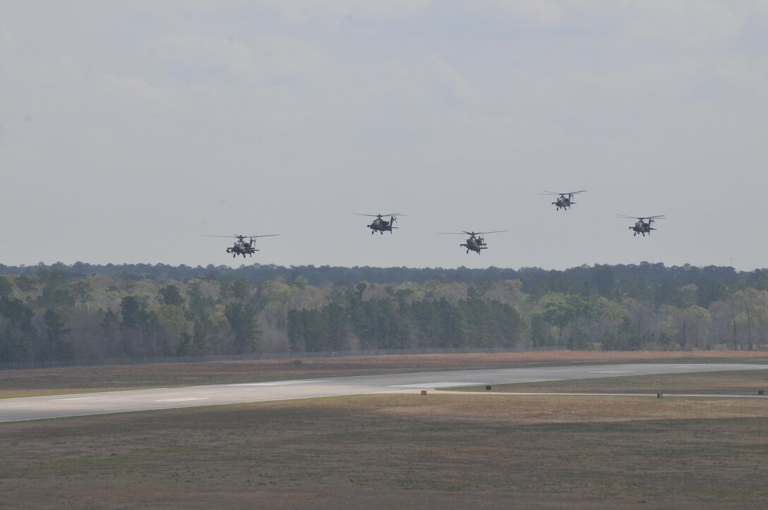 Five AH-64 Apache Helicopters, belonging to 1-158th Assault Reconnaissance Battalion (ARB), conduct “fly-by” in Conroe, Texas, during a ceremony to commemorate the last official flight of the Apache Helicopter in the U.S. Army Reserve, Mar. 6, 2016. 1-158th ARB is a direct reporting unit to the 11th Theater Aviation Command. The 11th Theater Aviation Command (TAC) is the only aviation command in the Army Reserve. (U.S. Army Photo by Capt. Matthew Roman, 11th Theater Aviation Command Public Affairs Officer)