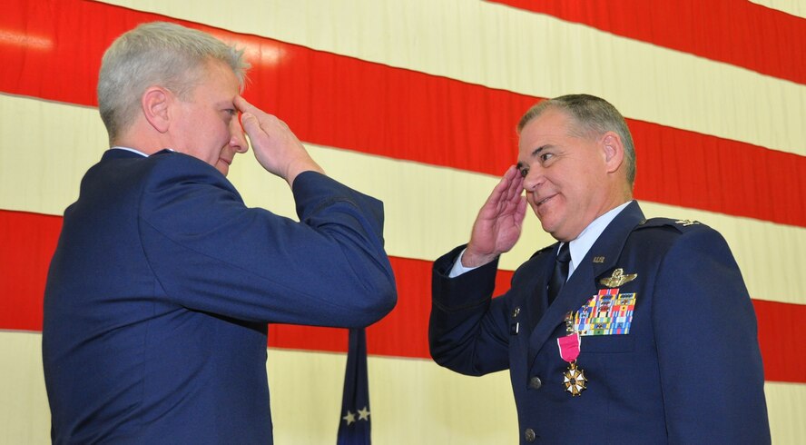 Col. Erich C. Novak, left, salutes Col. Jack H. Pittman, Jr. after presenting him with the Legion of Merit award. Pittman was honored during his retirement ceremony March 6, 2016 capping a 33-year career with the Air Force Reserve. The 302nd Airlift Wing commander was rated a command pilot with more than 6,000 total flying hours in six different airframes. Novak is the 302nd AW vice commander. (U.S. Air Force photo/Daniel Butterfield)