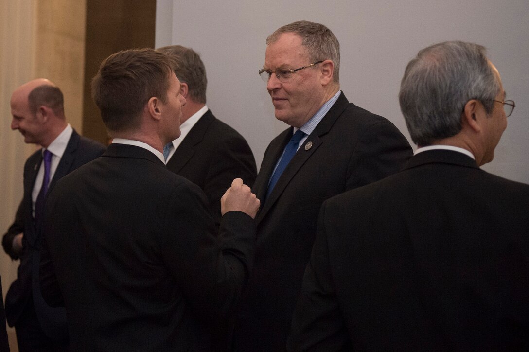 Deputy Defense Secretary Bob Work, center, meets with Satellite Industry Association members before delivering remarks at the association's leadership dinner in Washington, D.C., March 7, 2016. DoD photo by Air Force Senior Master Sgt. Adrian Cadiz