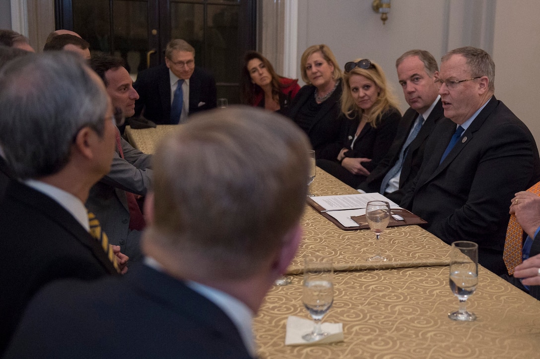 Deputy Defense Secretary Bob Work, right, meets with Satellite Industry Association members before delivering remarks at the association's leadership dinner in Washington, D.C., March 7, 2016.  DoD photo by Air Force Senior Master Sgt. Adrian Cadiz