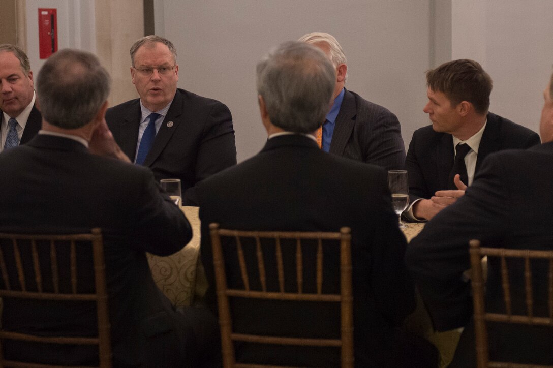 Deputy Defense Secretary Bob Work, second from left, meets with Satellite Industry Association members before delivering remarks at the association's leadership dinner in Washington, D.C., March 7, 2016. DoD photo by Air Force Senior Master Sgt. Adrian Cadiz