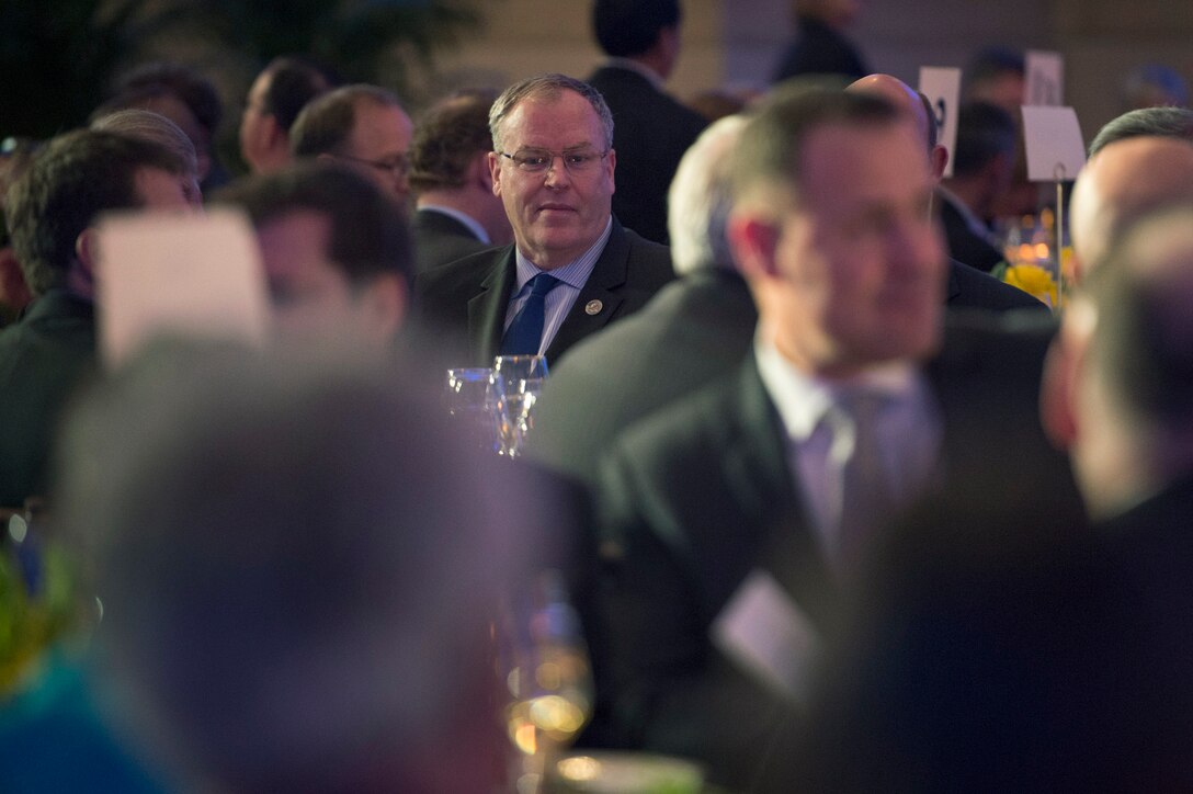 Deputy Defense Secretary Bob Work, center, attends the Satellite Industry Association's leadership dinner in Washington, D.C., March 7, 2016. DoD photo by Air Force Senior Master Sgt. Adrian Cadiz