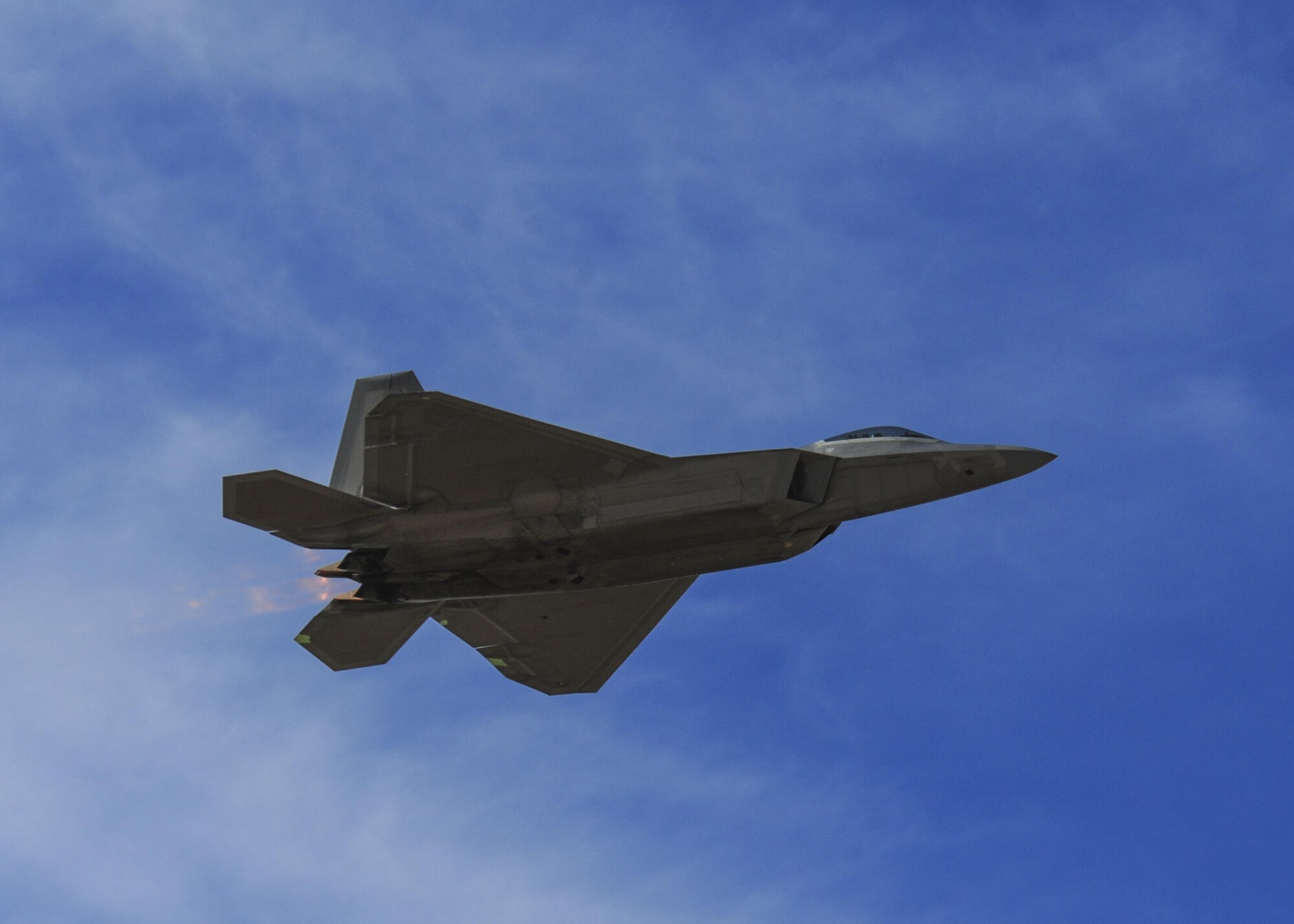 A U.S. Air Force F-22 Raptor flies overhead during the 2016 Heritage Flight Training and Certification Course at Davis-Monthan Air Force Base, Ariz., March 4, 2016. The Raptor performs both air-to-air and air-to-ground missions allowing full realization of operational concepts vital to the 21st century Air Force. (U.S. Air Force photo by Senior Airman Chris Massey/Released)