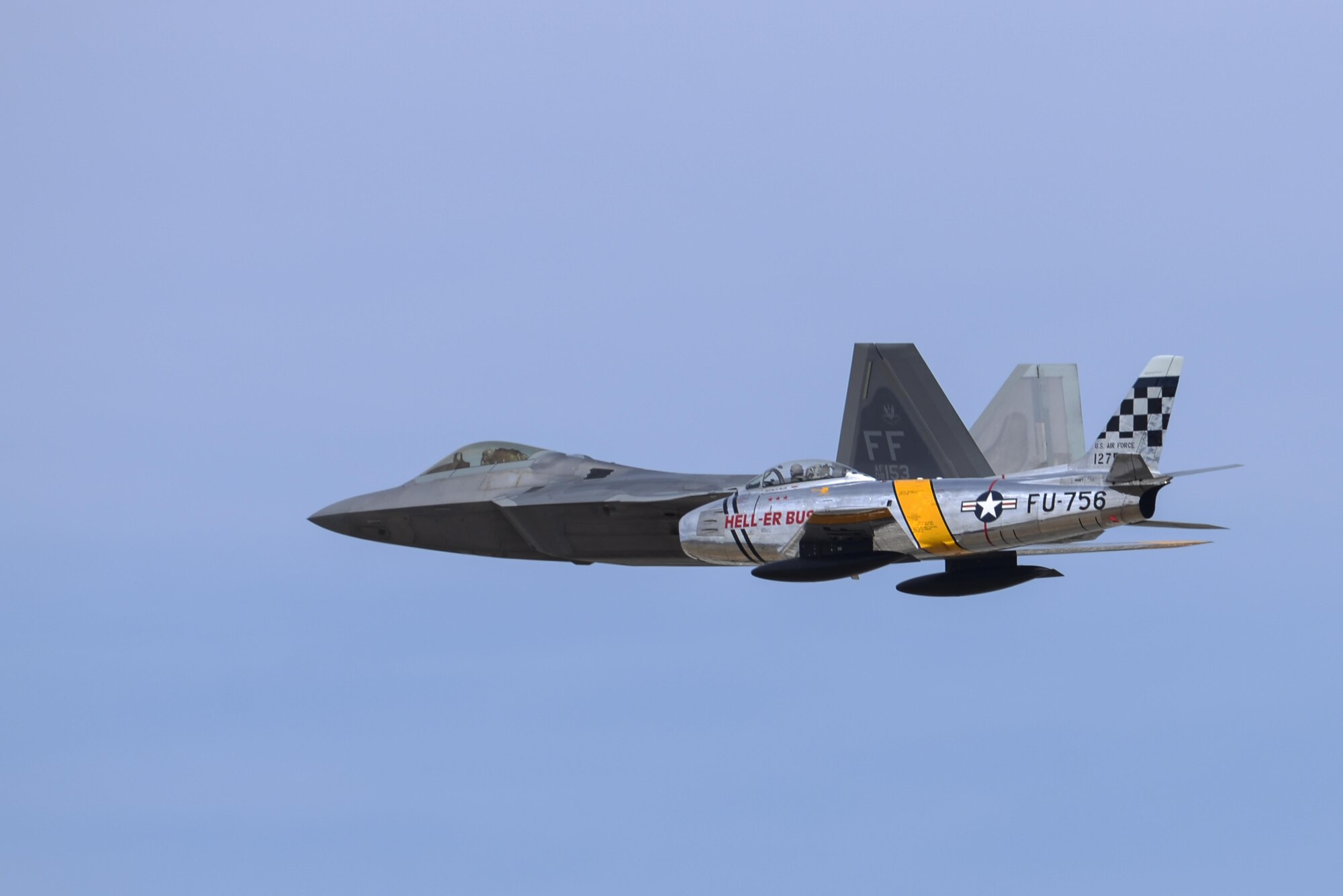 An F-22 Raptor and an F-86 Sabre fly in formation during the 2016 Heritage Flight Training and Certification Course at Davis-Monthan Air Force Base, Ariz., March 6, 2016. Established in 1997, the HFTCC certifies civilian pilots of historic military aircraft and U.S. Air Force pilots to fly in formation together during the upcoming air show season. (U.S. Air Force photo by Senior Airman Chris Massey/Released)