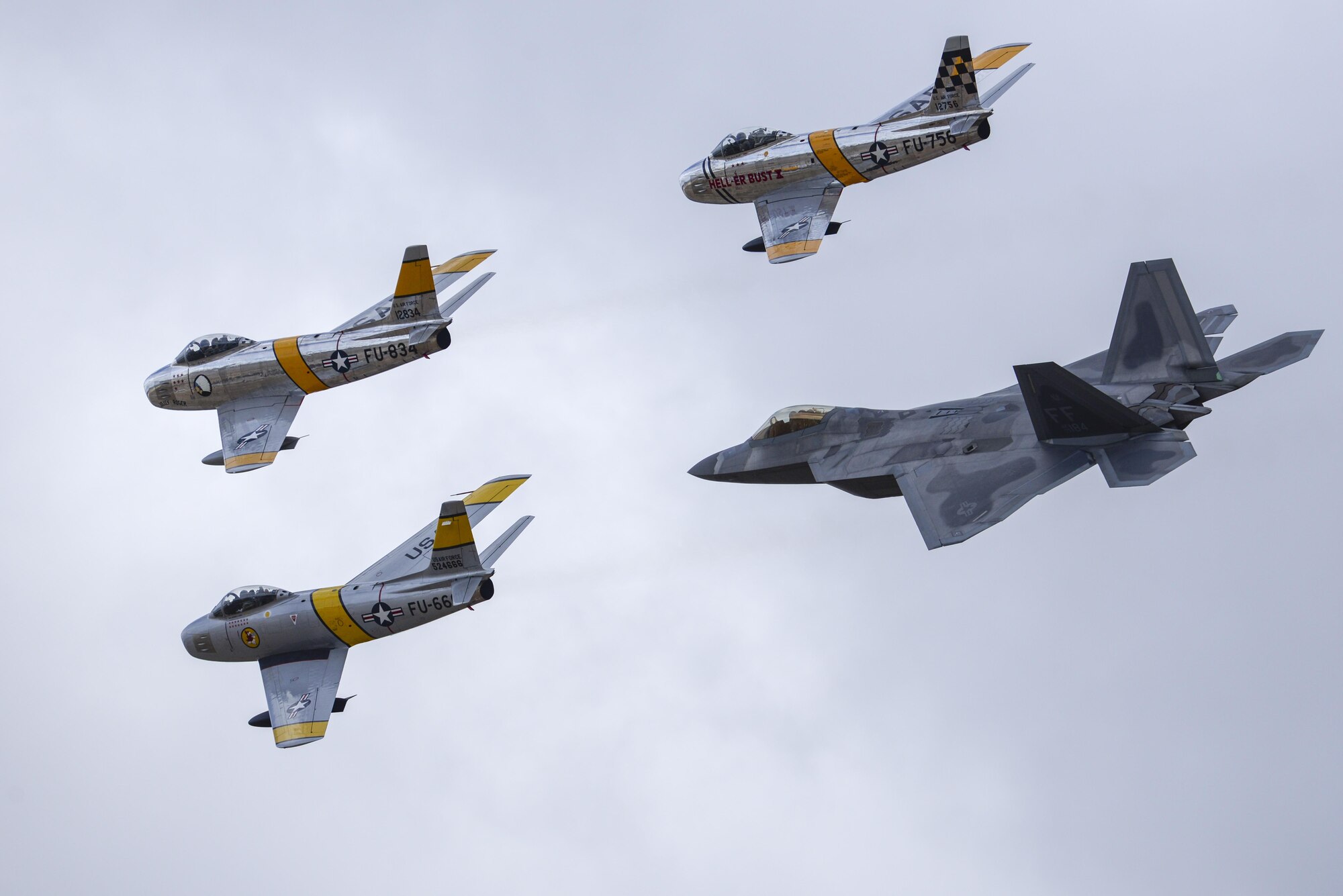 Three F-86 Sabres and a U.S. Air Force F-22 Raptor fly in formation during the 2016 Heritage Flight Training and Certification Course at Davis-Monthan Air Force Base, Ariz., March 6, 2016. Established in 1997, the HFTCC certifies civilian pilots of historic military aircraft and U.S. Air Force pilots to fly in formation together during the upcoming air show season. (U.S. Air Force photo by Senior Airman Chris Massey/Released)