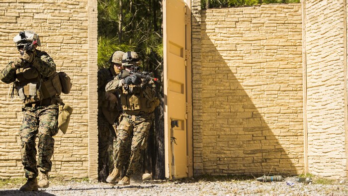 Marines with 2nd Law Enforcement Battalion raid a compound during tactical site exploitation training at Marine Corps Base Camp Lejeune, N.C., March 3, 2016. The TSE allows military police, intelligence analysts, criminal investigators and forensics experts to work cohesively and properly prosecute enemy suspects.