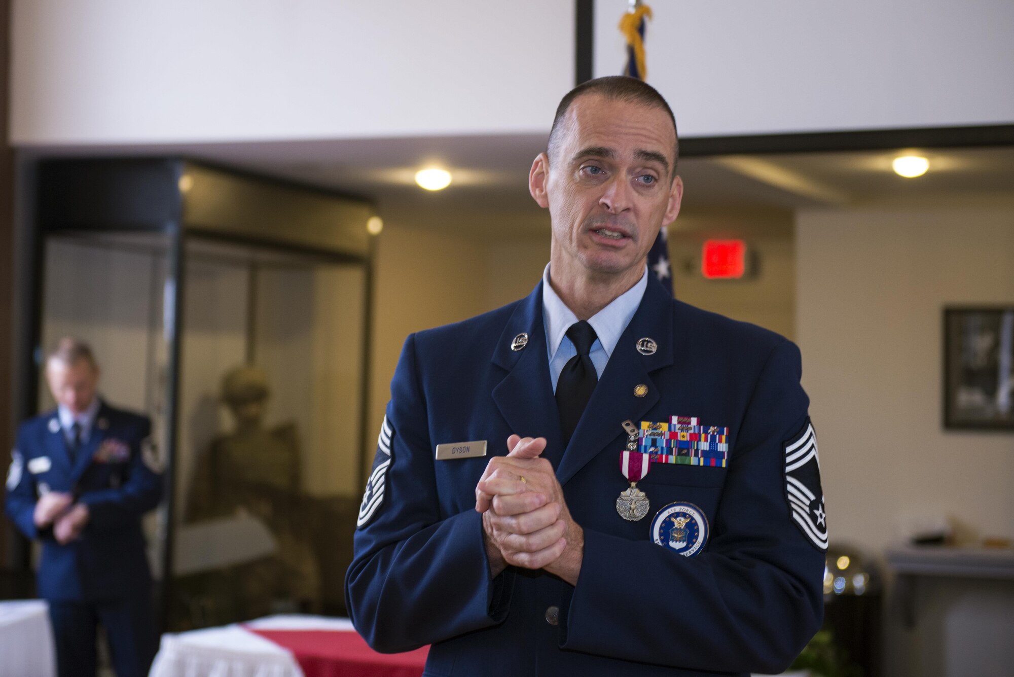 U.S. Air Force Chief Master Sgt. Edward Dyson, 336th Recruiting Squadron superintendent, bids farewell during his retirement ceremony, March 4, 2016, at Moody Air Force Base, Ga. Throughout his career, Dyson contributed as a law enforcement and criminal investigator, a military training instructor, an honor guardsman and a recruiter. (U.S. Air Force photo by Airman 1st Class Greg Nash/Released) 