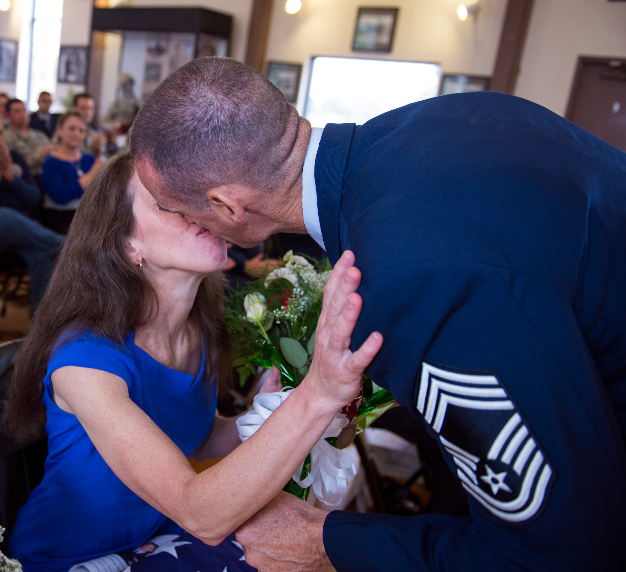 U.S. Air Force Chief Master Sgt. Edward Dyson, 336th Recruiting Squadron, embraces his wife, Robin, during his retirement ceremony, March 4, 2016, at Moody Air Force Base, Ga.  Dyson commended his family for supporting him throughout his 30-year journey of military service. (U.S. Air Force photo by Airman 1st Class Greg Nash/Released) 