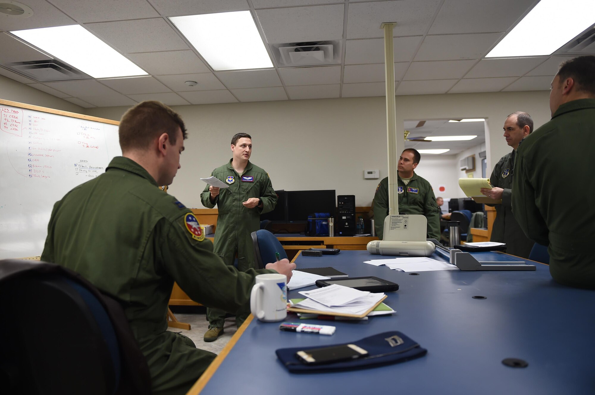 ALTUS AIR FORCE BASE, Okla. – Members of the 54th Air Refueling Squadron plan for the Altus Air Force Base Quarterly Exercise Program ALTEX 16A, March 3, 2016, inside the mission planning room at Altus AFB, Okla. For this exercise, multiple units assigned to the 97th Air Mobility Wing coordinated with members of the 62nd Airlift Wing from Joint Base Lewis-McChord, Wash. and the 60th AMW from Travis Air Force Base, Calif. to practice tactical scenarios that are prevalent in the current hostile areas of the Middle East. (U.S. Air Force photo by Senior Airman Dillon Davis/Released)