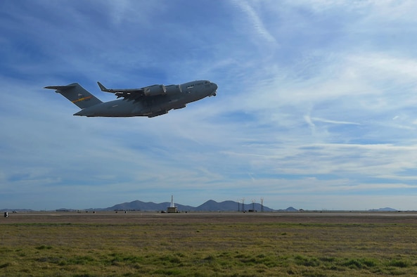 A U.S. Air Force C-17 Globemaster III cargo aircraft takes off, March 4, 2016, from the flightline of Altus Air Force Base, Okla. Eight refueling and cargo aircraft from the base flew in support of the Altus Air Force Base Quarterly Exercise Program (ALTEX) which was established to enhance aircrew instructor opportunities and provide exposure to realistic and emerging tactical scenarios. (U.S. Air Force photo by Senior Airman Dillon Davis/Released)