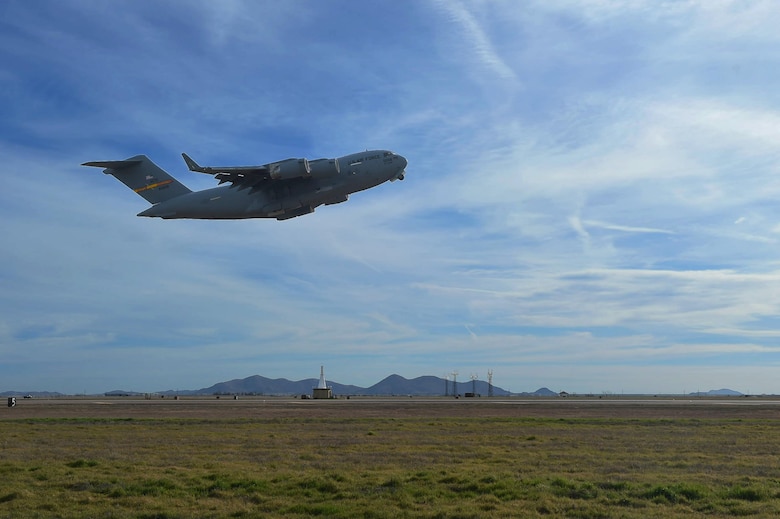 A U.S. Air Force C-17 Globemaster III cargo aircraft takes off, March 4, 2016, from the flightline of Altus Air Force Base, Okla. Eight refueling and cargo aircraft from the base flew in support of the Altus Air Force Base Quarterly Exercise Program (ALTEX) which was established to enhance aircrew instructor opportunities and provide exposure to realistic and emerging tactical scenarios. (U.S. Air Force photo by Senior Airman Dillon Davis/Released)
