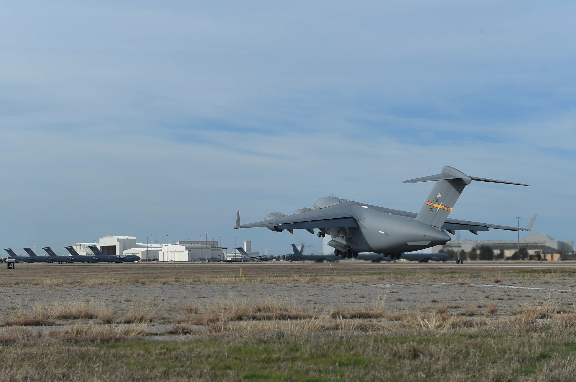 A U.S. Air Force C-17 Globemaster III cargo aircraft takes off, March 4, 2016, from the flightline of Altus Air Force Base, Okla. Eight refueling and cargo aircraft from the base flew in support of the Altus Air Force Base Quarterly Exercise Program (ALTEX) which was established to enhance aircrew instructor opportunities and provide exposure to realistic and emerging tactical scenarios. (U.S. Air Force photo by Senior Airman Dillon Davis/Released)