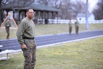 Brooklyn, N.Y.-native Sgt. Maj. Brian Taylor, senior enlisted advisor for Chemical Biological Incident Response Force (CBIRF), U.S. Marine Forces Command (MARFORCOM), prepares to call the battalion to attention prior to a battalion-wide physical training (PT) session. CBIRF Corporals led the battalion in a PT event ranging from pushups and lunges to buddy drags and fireman carry drills the morning before their graduation from Corporals Leadership Course, Feb. 26, 2016. The noncommissioned officers completed the 3 week course curriculum that included sword and guidon manual, land navigation, Marine Corps promotion system for sergeants and below and other small unit leader skills and traits. (Official USMC Photos by Sgt. Santiago G. Colon Jr./Released)
