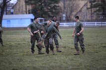 Upland, Calif.-Native Sgt. Matthew Bentley, a data systems technician with Chemical Biological Incident Response Force (CBIRF), U.S. Marine Forces Command (MARFORCOM), fireman carries another Marine during a battalion-wide physical training (PT) session. CBIRF Corporals led the battalion in a PT event ranging from pushups and lunges to buddy drags and fireman carry drills the morning before their graduation from Corporals Leadership Course, Feb. 26, 2016. The noncommissioned officers completed the 3 week course curriculum that included sword and guidon manual, land navigation, Marine Corps promotion system for sergeants and below and other small unit leader skills and traits. (Official USMC Photo by Sgt. Santiago G. Colon Jr./Released)
