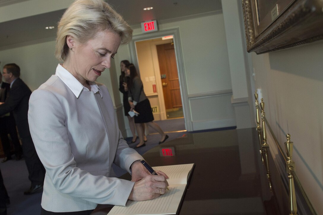 German Defense Minister Ursula von der Leyen signs the guest book at the Pentagon, March 8, 2016. DoD photo by Air Force Senior Master Sgt. Adrian Cadiz