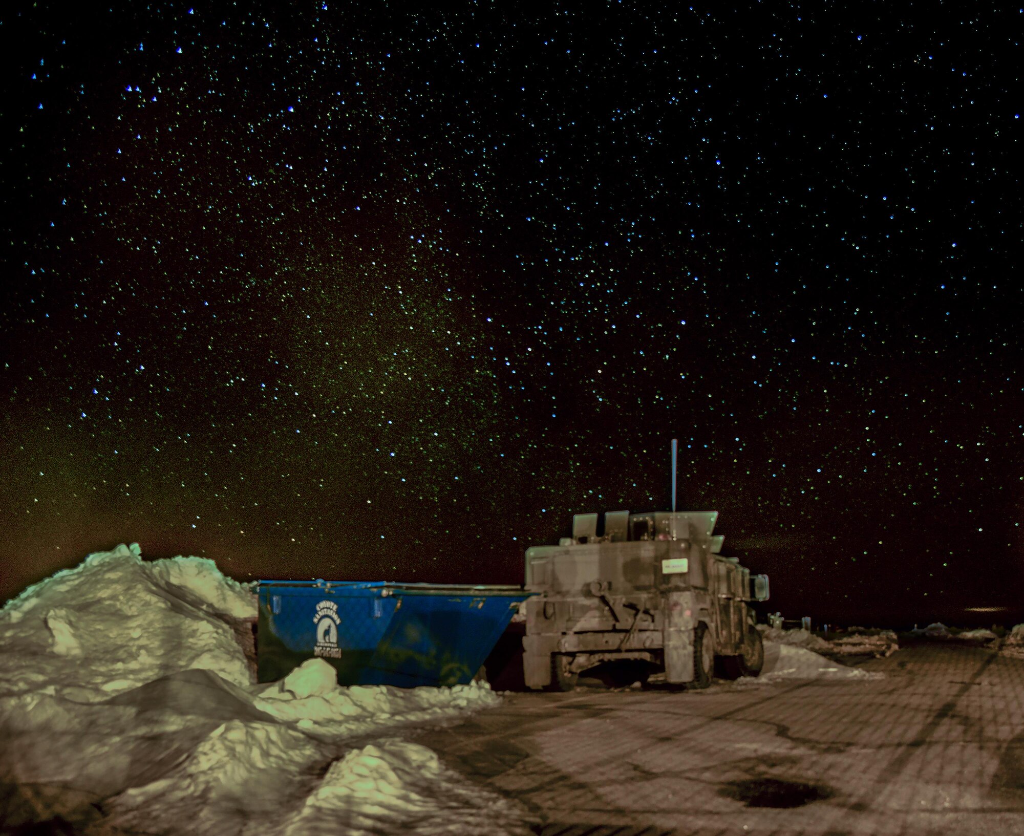 A 90th Missile Security Forces Squadron Humvee sits on the access road of a Missile Alert Facility in the F.E. Warren Air Force Base, Wyo., missile complex, in this composite of two photos taken on Feb. 8, 2016. Security forces, missileers and other 90MWAirmen stay vigilant 24/7. (U.S. Air Force photo illustration by Senior Airman Jason Wiese)