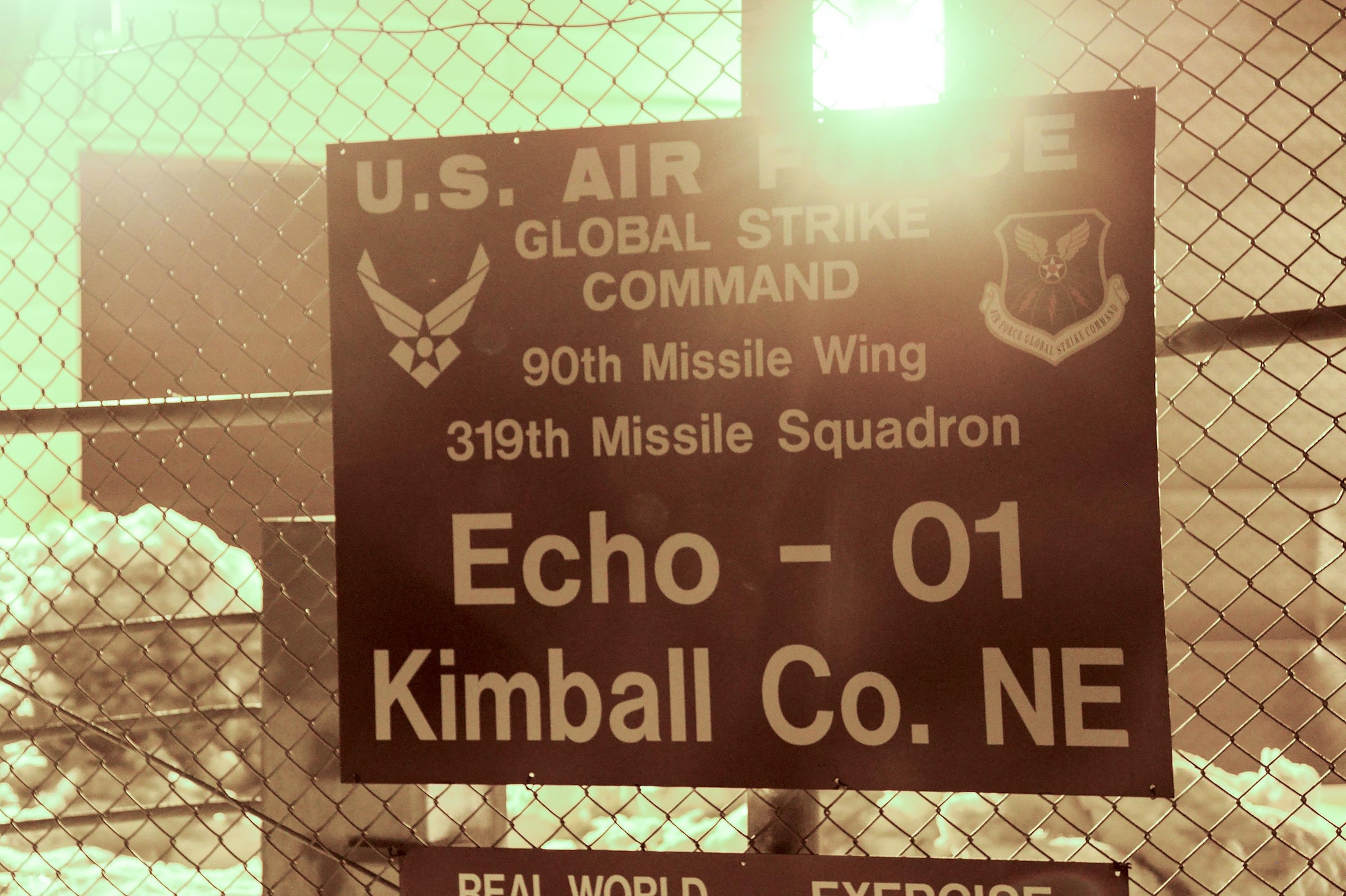 A sign hangs on the perimeter fence of a Missile Alert Facility in the F.E. Warren Air Force Base, Wyo., missile complex. MAFs house underground launch control centers in which missileers man the Minuteman III Weapon System, while topside security forces Airmen, facility managers, chefs and occasionally maintenance personnel stay to perform their critical mission roles. (U.S. Air Force photo by Senior Airman Jason Wiese)
