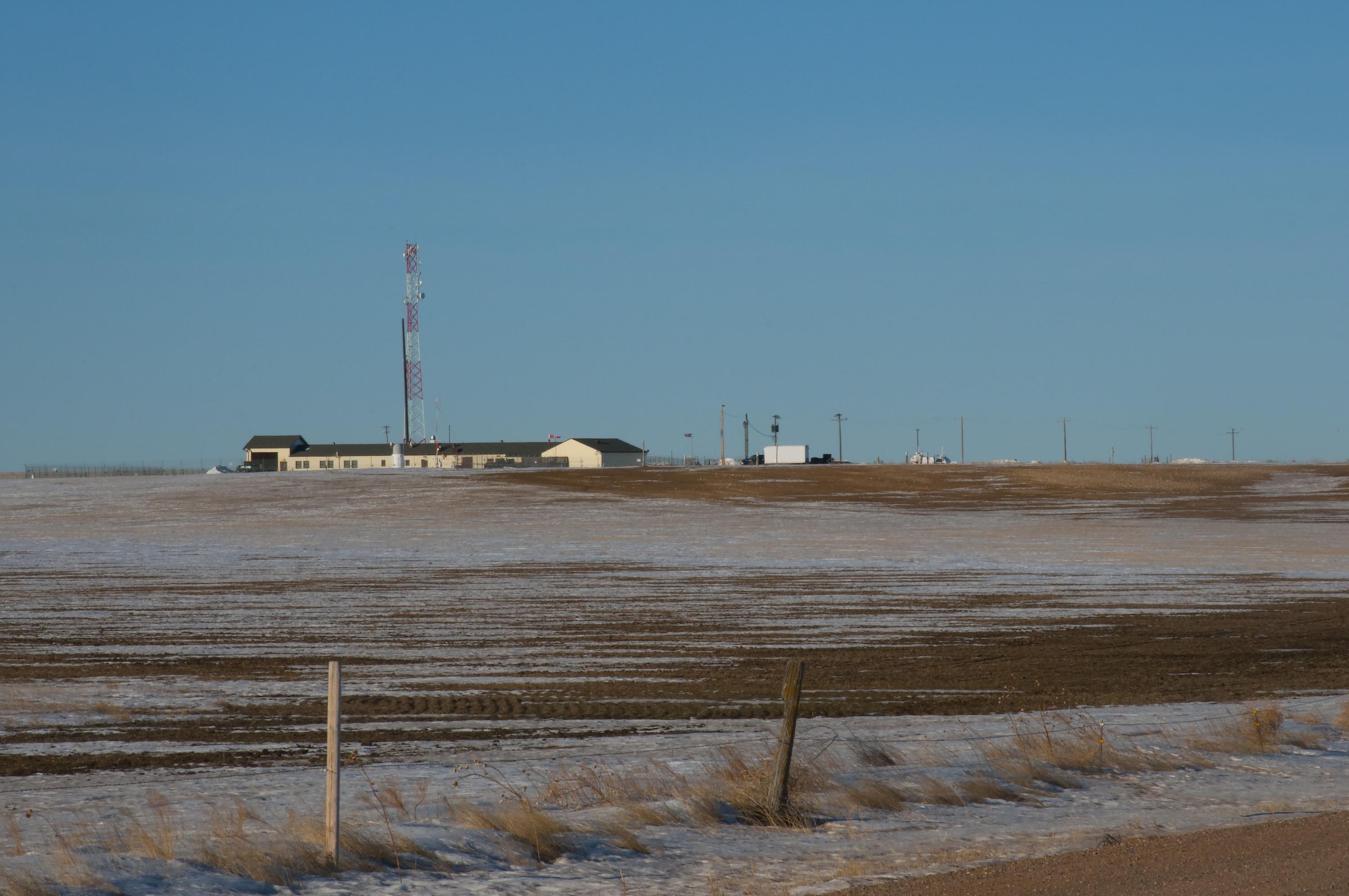 A Missile Alert Facility quietly rests amongst the hills in the F.E. Warren Air Force Base, Wyo., missile complex. 24/7, 365 days a year, the topside buildings houses support forces, while missileers work underground, manning launch control centers. (U.S. Air Force photo by Senior Airman Jason Wiese)