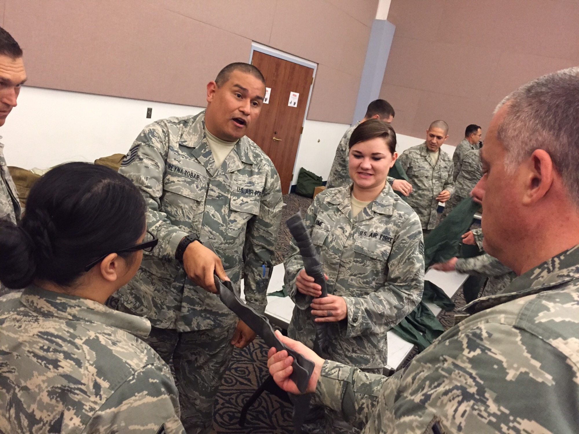 Tech. Sgt. Rene Reyna-Tobar, 940th Aerospace Medicine Squadron medical services technician, shows a group of logistics and medical personnel about splints used to stabilize fractures, at Beale Air Force Base, California, March 6, 2016.   These splints are made out of a special material which easily conforms to a person’s limb making it easier to splint a fracture. They are issued to each deploying Airman in an IFAK or Individual First Aid Kit, which contains a number of first aid supplies they may need.  (U.S. Air Force photo by Tech. Sgt. Heather Skinkle)