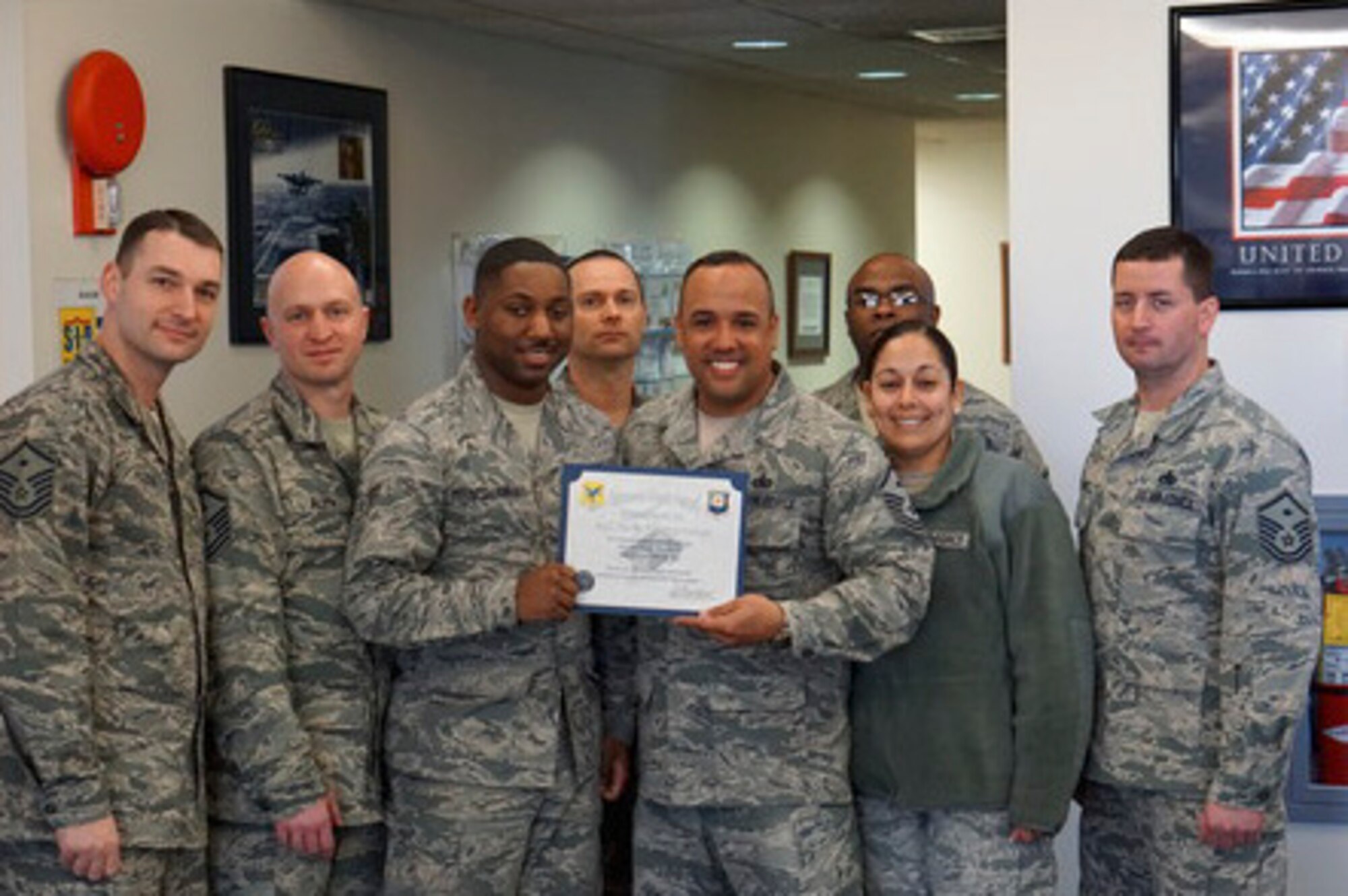 Airman 1st Class Rafiq D. Pouncy-Jones, 436th Airlift Wing Judge Advocate paralegal, is presented the Dover First Sergeant Council’s Diamond Sharp Award March 3, 2016, at Dover Air Force Base, Del. Pouncy-Jones, a native of Philadelphia, is in charge of all non-judicial punishments and supports other Military Justice matters such as courts-martial and administrative separations. (Courtesy photo)