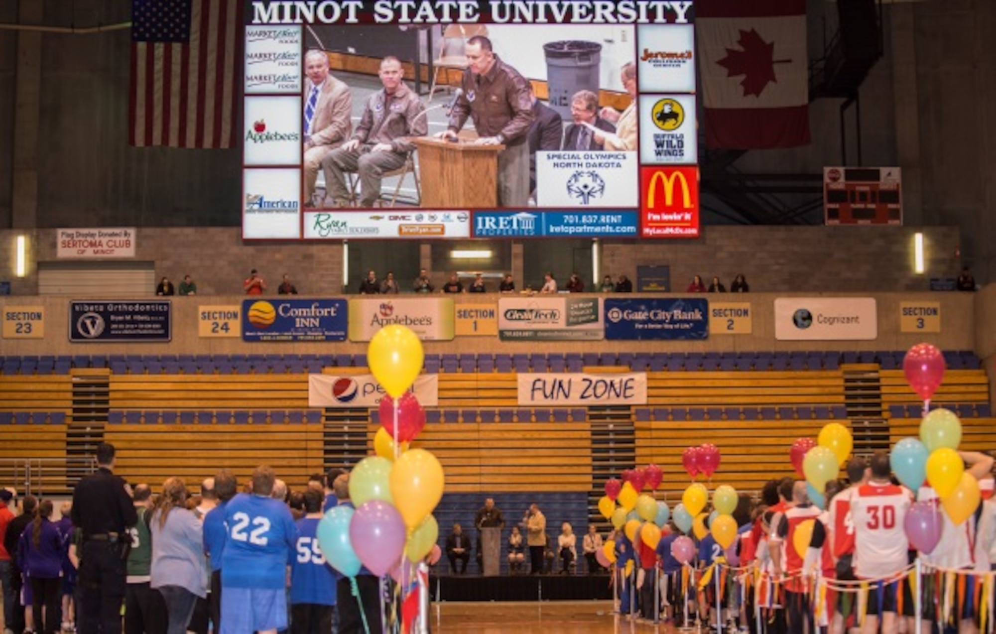 Col. David Ballew, 5th Bomb Wing vice commander, speaks during the pre-game ceremonies on behalf of Minot Air Force Base at the North Dakota Special Olympics in Minot, N.D., March 4, 2016. Col. Ballew and Col. Michael Lutton, 91st Missile Wing commander, among other Minot AFB members volunteered to help at the Special Olympics. (U.S. Air Force photo/Airman 1st Class Christian Sullivan)