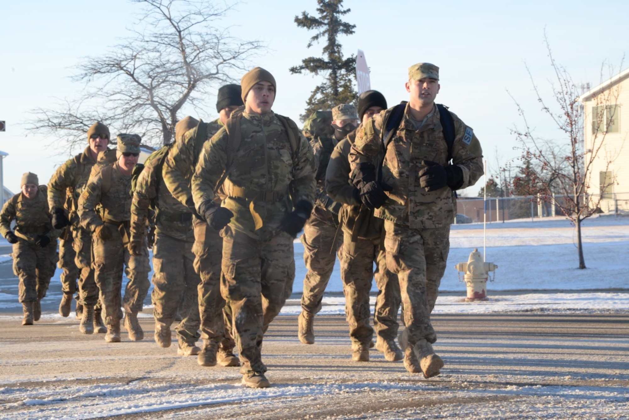 Members of the 91st Security Forces Group jog during ruck training at Minot Air Force Base, N.D., Feb. 12, 2016. They are preparing for the Bataan Death March Ruck that will take place at White Sands Missile Range, N.M. (U.S. Air Force photo/Airman 1st Class Christian Sullivan)