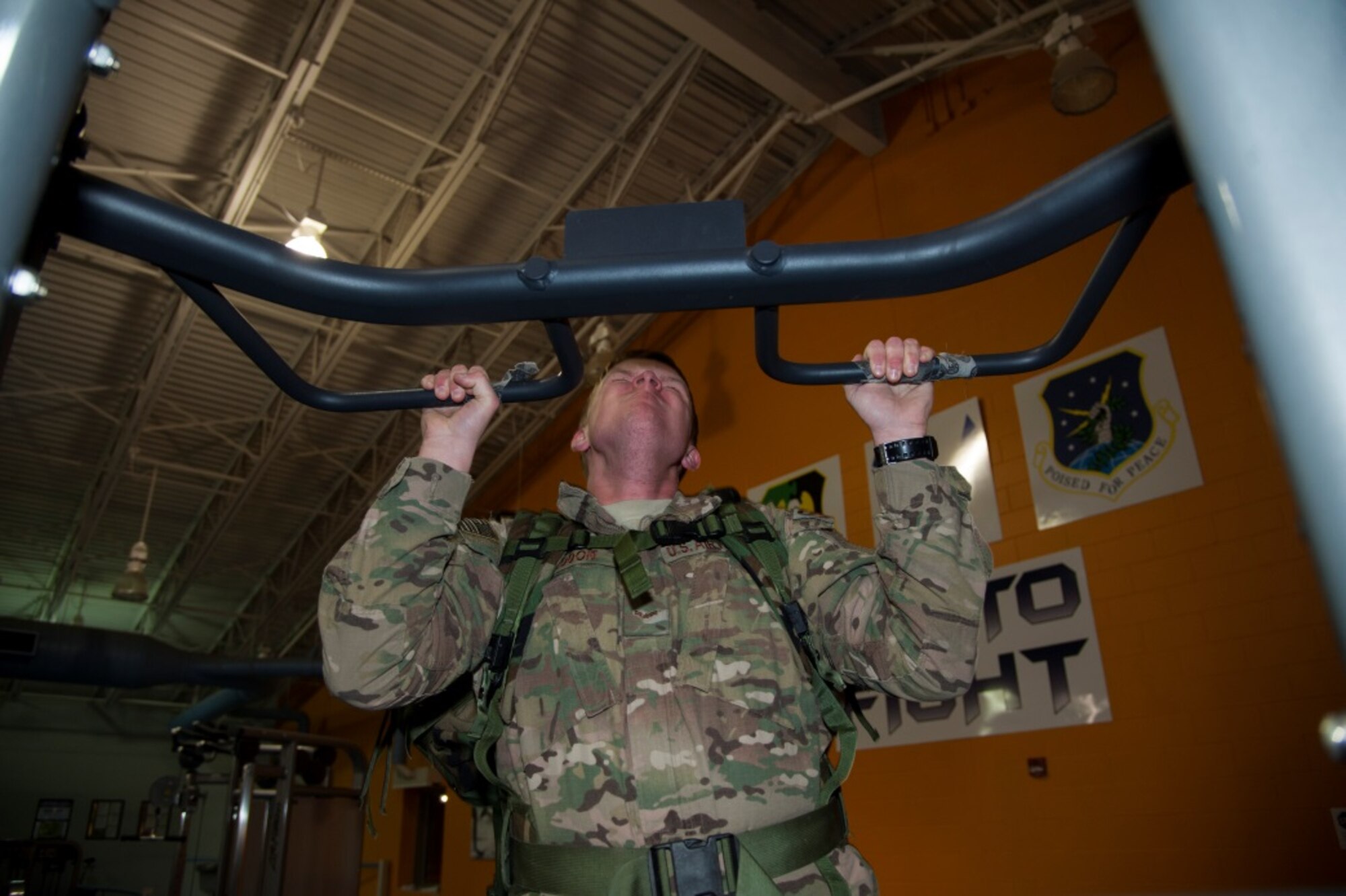 Airman 1st Class Brian Sneddon, 91st Missile Security Forces Sqaudron response force leader, performs a pull up during training for the Bataan Memorial Death March Ruck at Minot Air Force Base, N.D., Jan. 6, 2016. Participants have been preparing for the ruck since October and will depart for White Sands N.M. where the ruck will take place, in March. (U.S. Air Force photo/Airman 1st Class Christian Sullivan)