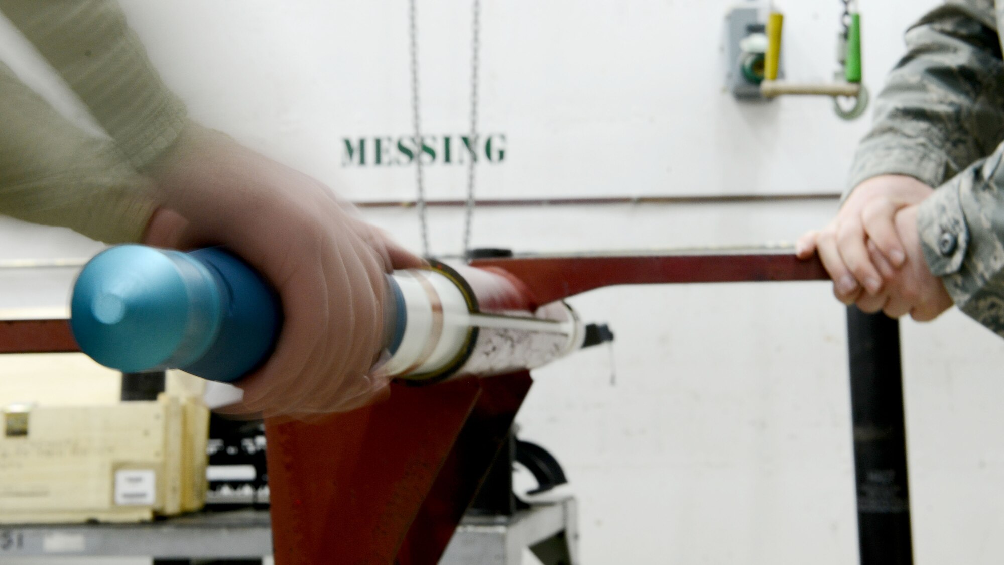 Airmen from the 31st Munitions Squadron install a practice warhead onto a rocket motor March 3, 2016, at Bodø Main Air Station, Norway. Munitions Squadron Airmen built and delivered various practice bombs, rockets, and chaff and flares for F-16 Fighting Falcons during Exercise Cold Response 16. (U.S. Air Force photo by Tech. Sgt. R.J. Biermann/Released)
