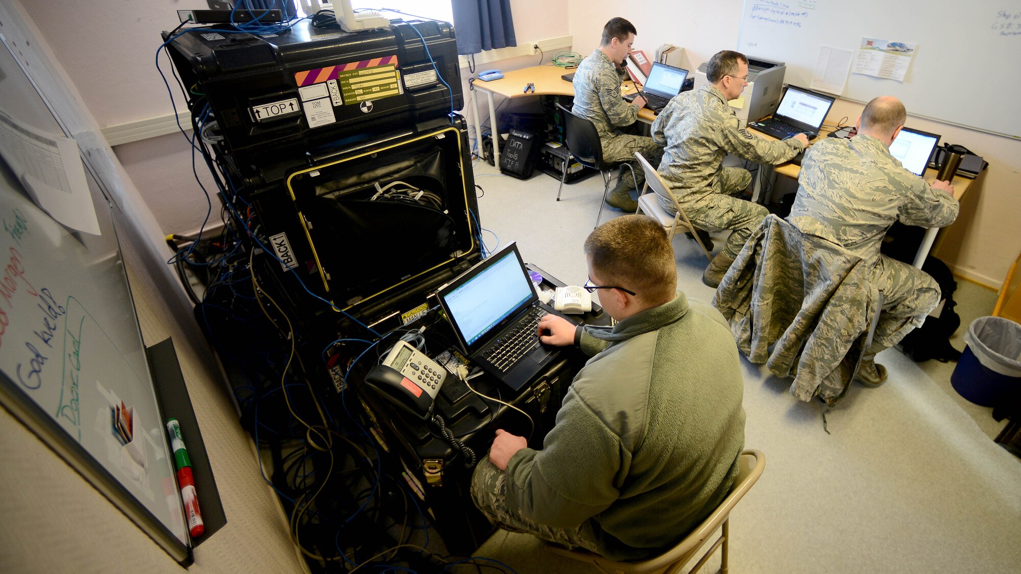 Air National Guard Airmen, assigned to the 265th Combat Communications Squadron, monitor network connections during Exercise Cold Response 16 at Bodø Main Air Station, Norway, March 1, 2016. Combat Communications Airmen often arrive early at exercise locations to set up all communications systems for participants. (U.S. Air Force photo by Tech. Sgt. R.J. Biermann/Released)
