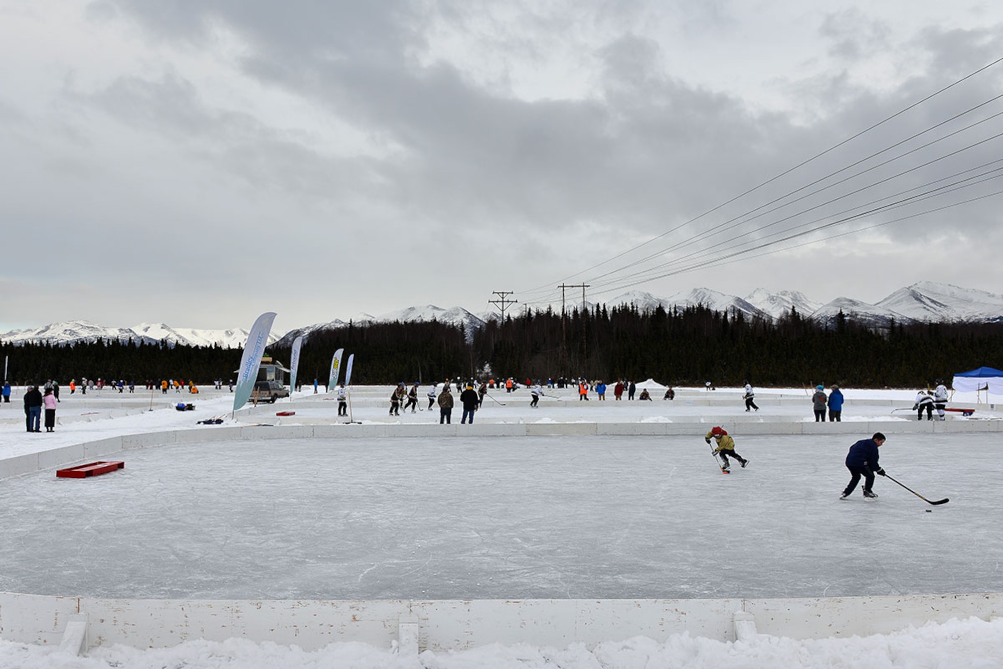 Players warm up in between matches at The Last Frontier Pond Hockey Classic hosted in Anchorage, Alaska March 5.The tournament was held as part of the Fur Rendezvous festivities, and featured eight separate divisions, each with multiple groups of teams competing to be the best in their respective division. (U.S. Air Force photo by Airman 1st Class Kyle Johnson)