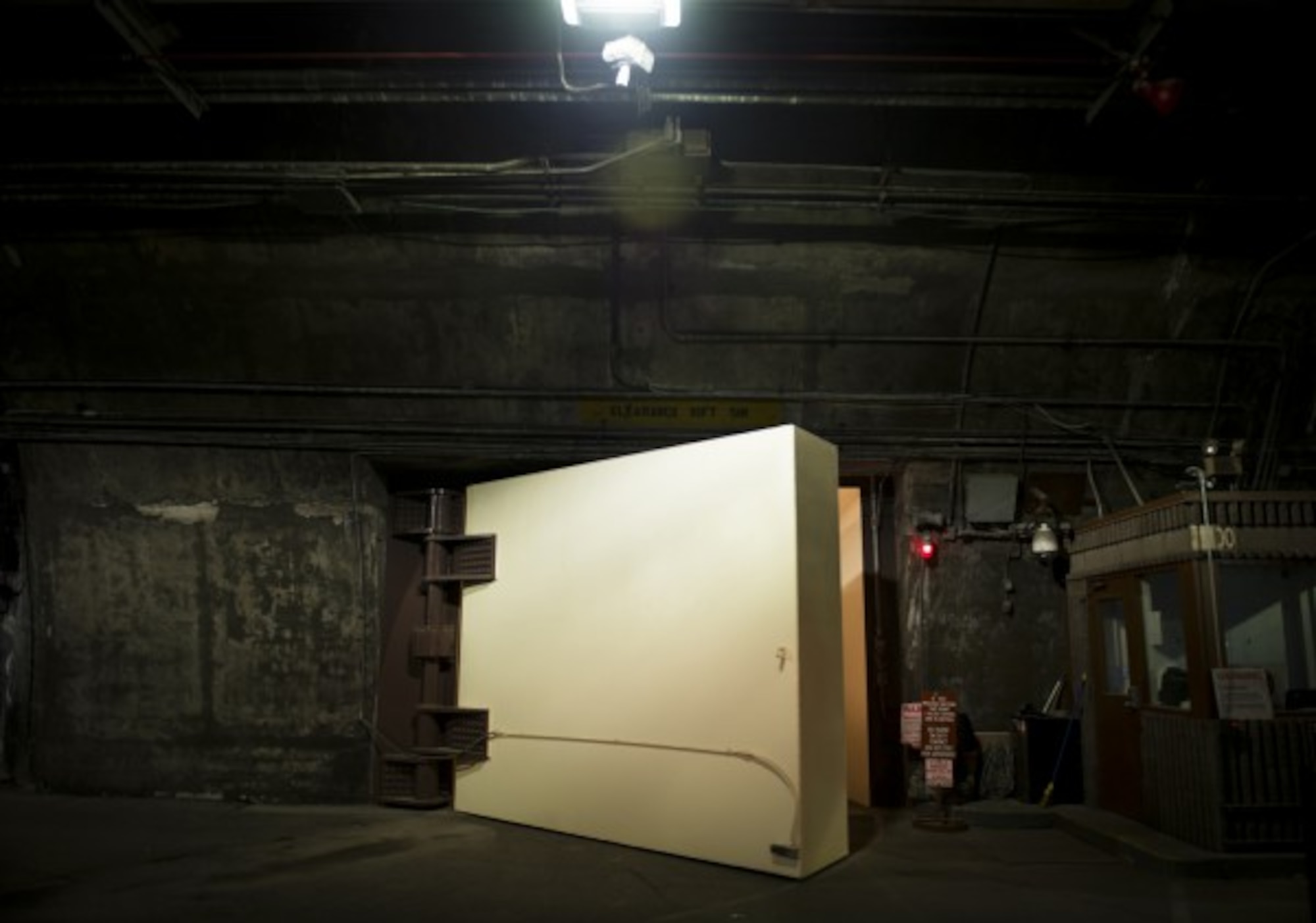 CHEYENNE MOUNTAIN AIR FORCE STATION, Colo. - The two 23-ton blast doors at the entrance inside the Cheyenne Mountain Complex are made of steel and can take up to 20 seconds to close with the assistance of hydraulics. If the hydraulics were to fail, the military guards stationed in the tunnel can close the doors in 40 seconds. (Photo by Staff Sgt. Andrew Lee )