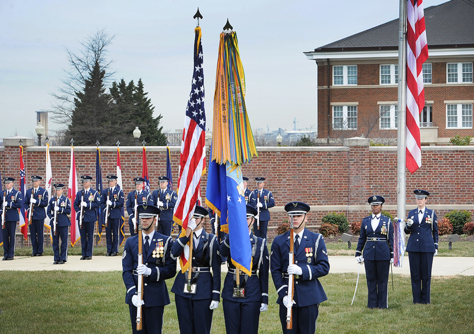 Members of the United States Air Force Honor Guard present the nation’s colors during a ceremony to recognize four of the first five female enlisted ceremonial guardsmen at Joint Base Anacostia-Bolling, Mar. 8. The event included a formal lawn ceremony, a ribbon-cutting to christen a display case honoring the first women to join the Air Force Honor Guard, and a panel discussion. (U.S. Air Force photo/Jim Lotz)