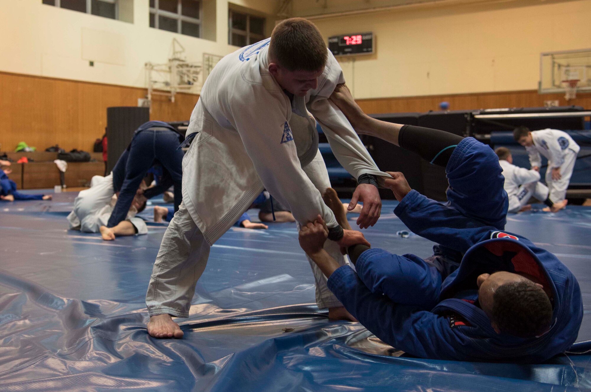 Endure Brazilian jiu-jitsu Misawa members spar during a practice at Misawa Air Base, Japan, Feb. 17, 2016. Although this martial arts style contains standing movements, it is known for its ground-fighting techniques. Misawa’s Brazilian jiu-jitsu team practices three times a week to better develop their skill. (U.S. Air Force photo by Airman 1st Class Jordyn Fetter)