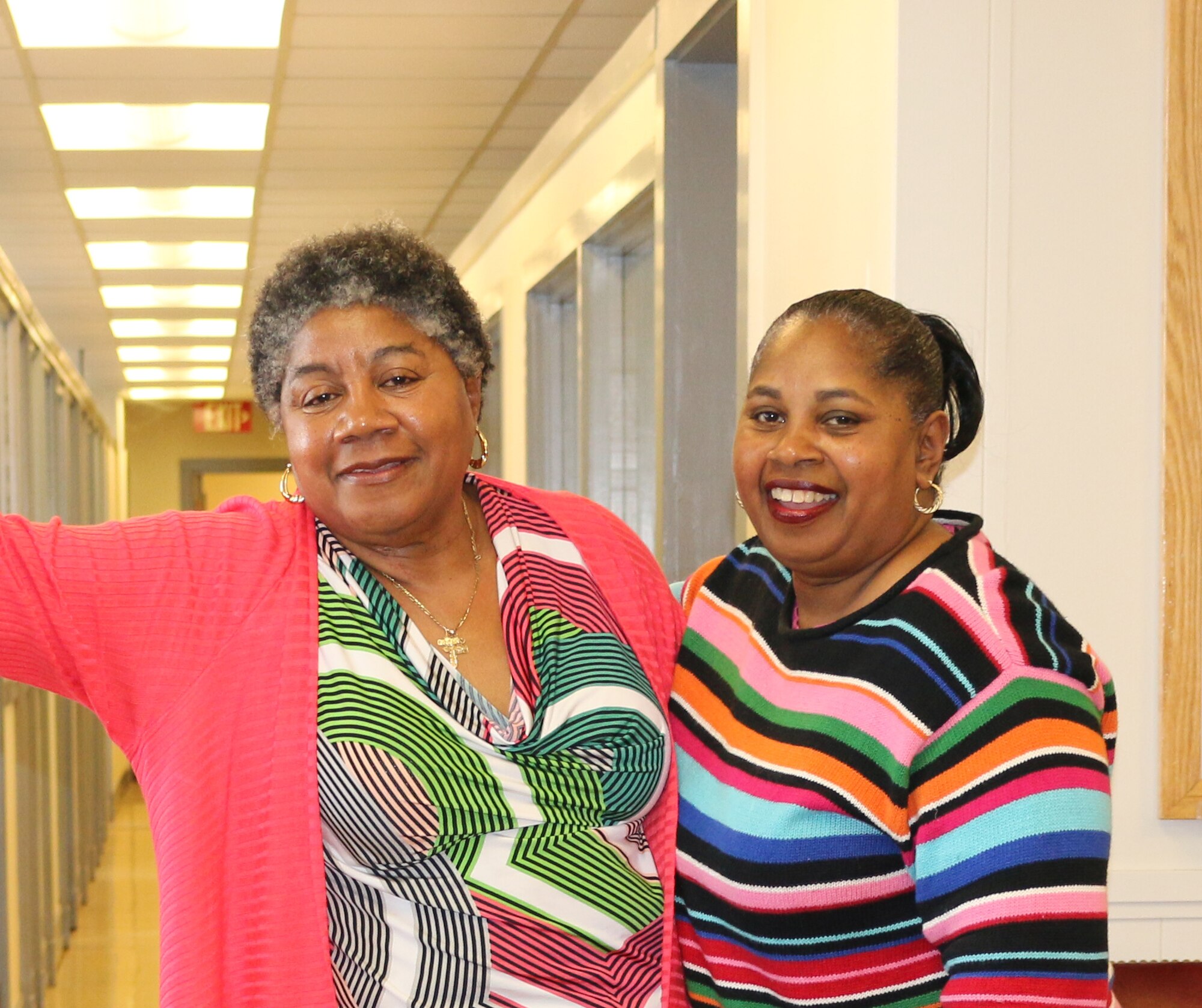 AEDC team members and sisters Narlane Hampton (left) and Faye Ford have worked in the same building for 30 years and currently have offices beside each other. Hampton works in the ATA Property Disposal Department and Ford works in the ATA Purchasing Department. (U.S. Air Force photo/Holly Fowler)