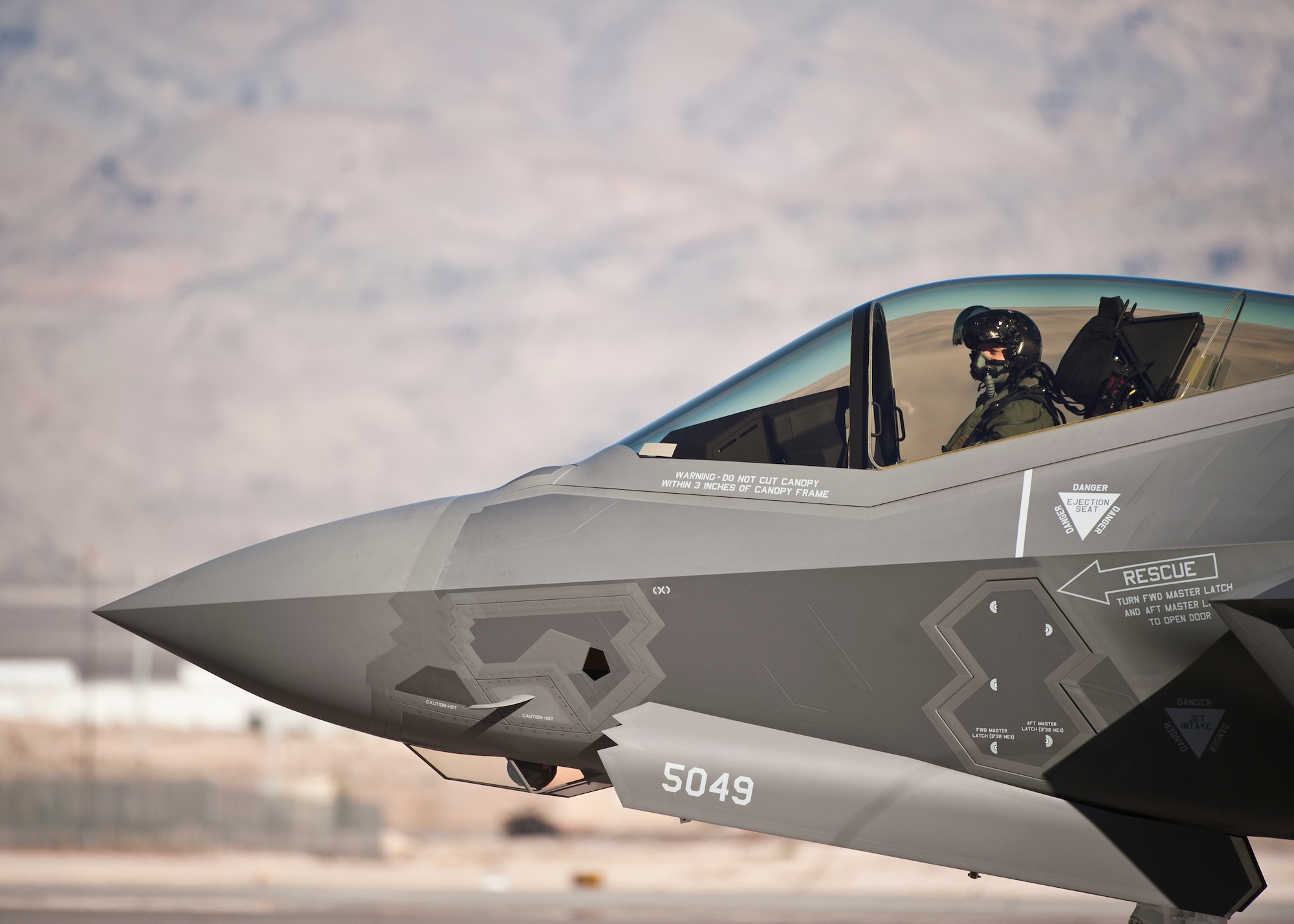 Capt. Brent Golden taxies an F-35A Lightning II at Nellis Air Force Base, Nev. The F135 engine, the afterburning turbofan developed for the F-35 Lighting II, is undergoing corrosion testing at AEDC to see how it performs in the sea-air environment. All-weather testing of the aircraft was conducted at McKinley Climatic Laboratory, Eglin AFB, Fla, last year. (U.S. Air Force photo/Staff Sgt. Siuta B. Ika)  