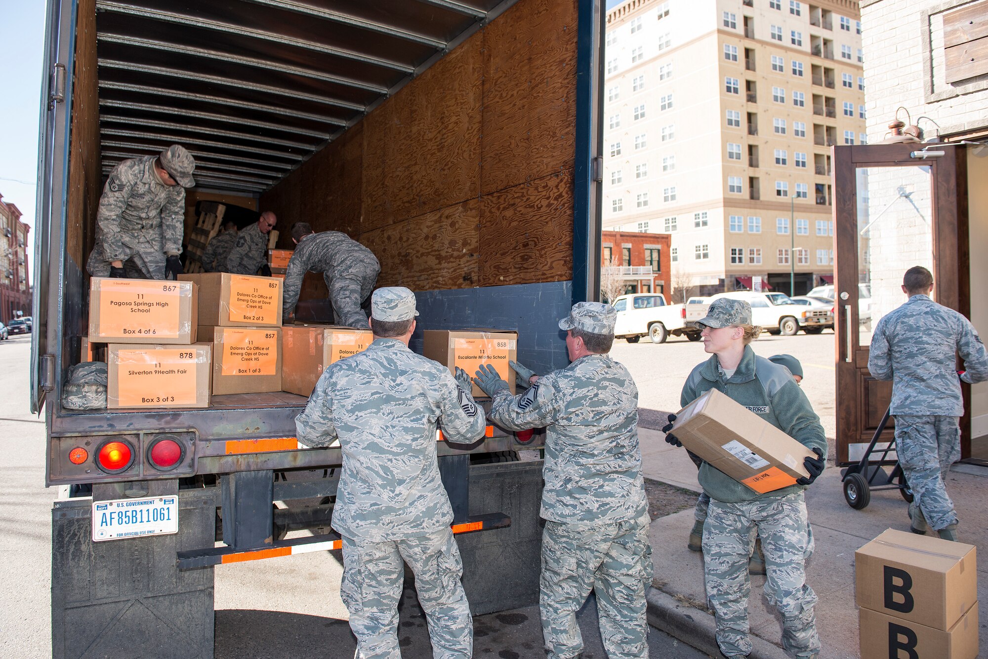 Members of the 233d Space Group, Colorado Air National Guard, Greeley, Colo. help load boxes of medical supplies onto one of their vehicles in order to help distribute them to all corners of Colorado for the annual 9Health Fair. This Innovative Readiness Training program not only provides support to the community, it also helps members of the 233 SG accomplish mandatory training time driving the semi-trucks. (U.S. Air National Guard photo by Senior Master Sgt. John Rohrer)
