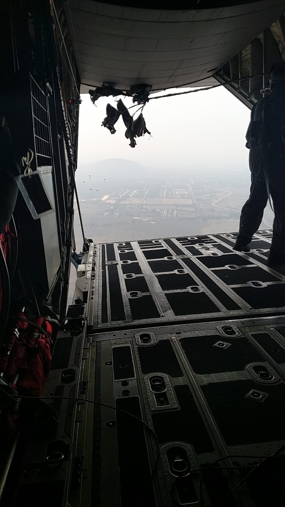 A 143d Airlift Wing C-130J Super Hercules loadmaster completes an airdrop during exercise Cobra Gold 2016 an annual Thai-U.S. co-sponsored joint and multinational exercise. Photo provided by Staff Sergeant Zachary Walker, 143d Maintenance Group