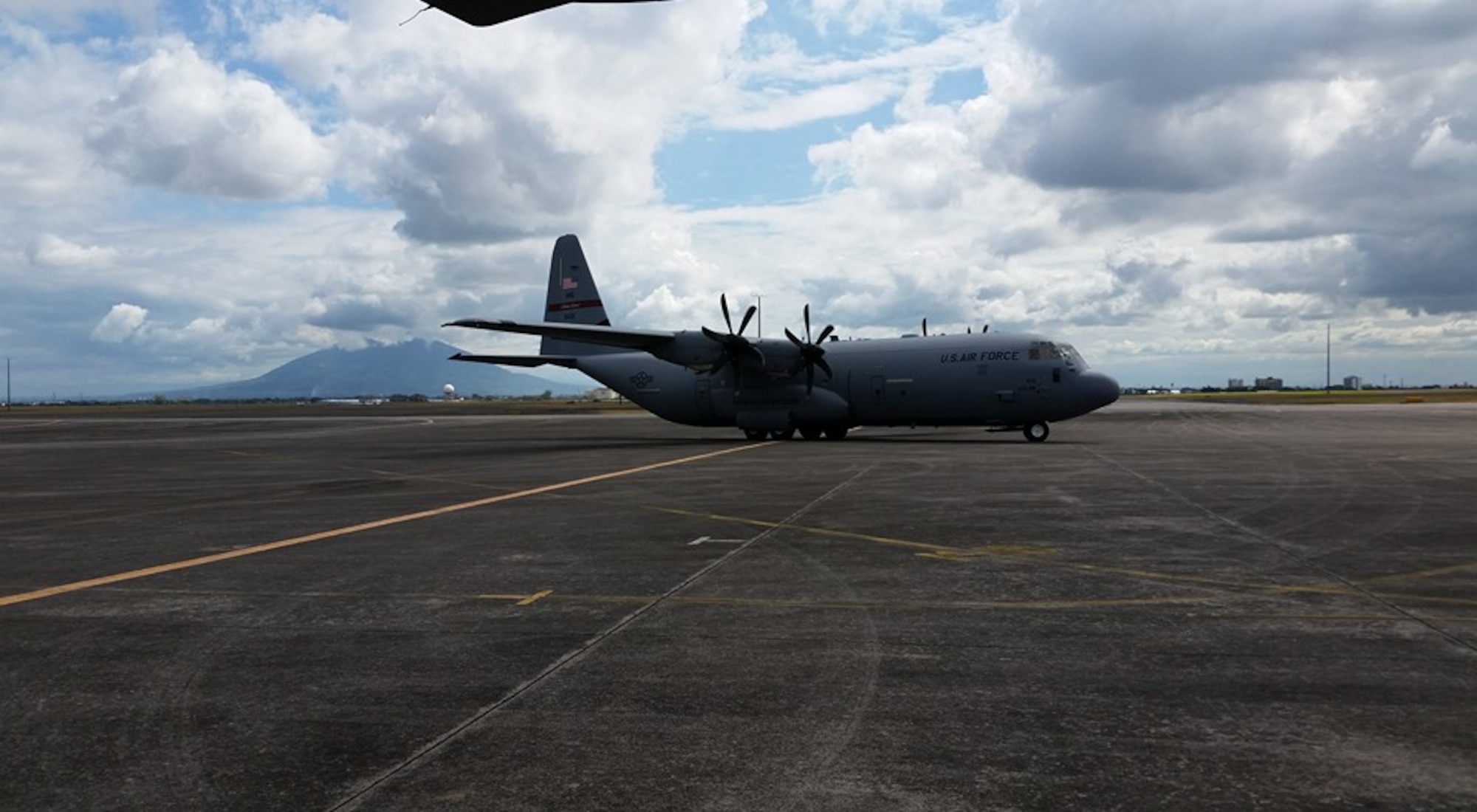 a C-130J Super Hercules sits on the runway