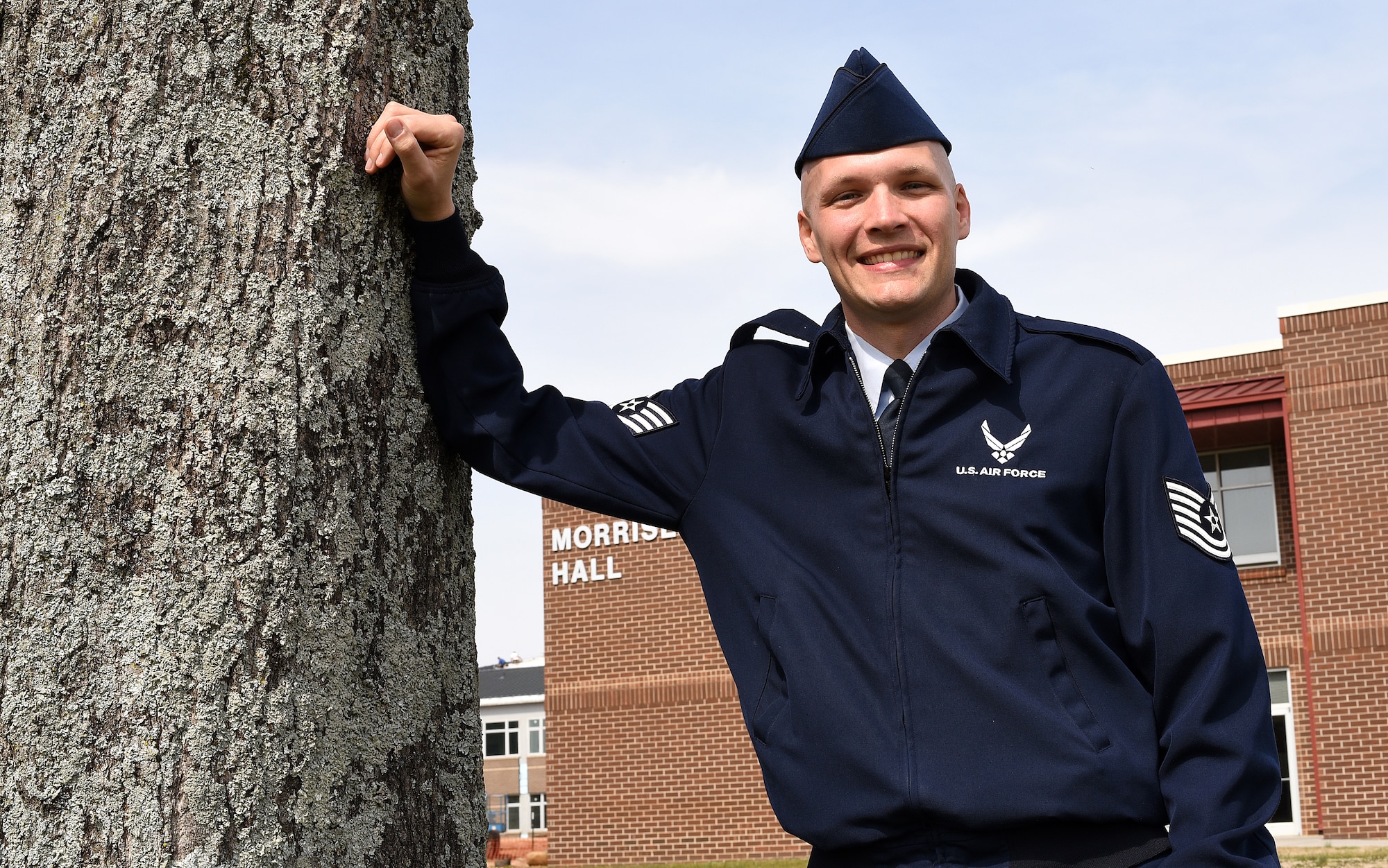 MCGHEE TYSON AIR NATIONAL GUARD BASE, Tenn. - Tech. Sgt. John C. McClean stops on campus, just outside the Morrisey Hall classroom building, while on his way to teach Air Force enlisted professional military education. McClean is a regular Air Force chaplain assistant assigned as an instructor to the Paul H. Lankford EPME Center. (U.S. Air National Guard photo by Master Sgt. Mike R. Smith/Released)