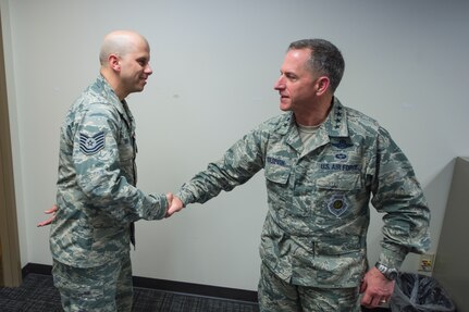 Air Force Vice Chief of Staff Gen. David L. Goldfein presents his coin to Technical Sgt. Adam Vera, a cyber-operator assigned to the 91st Cyber Operations Squadron during a visit at Joint Base San Antonio, Texas March 3. Goldfein also received briefings focused on 24th Air Force – AFCYBER’s command and control of cyber forces and took the opportunity to personally thank the cyber warriors as well as to stress the significance of cyber in today’s multi-domain operations. (U.S. Air Force photo by MSgt Luke P. Thelen/Released)