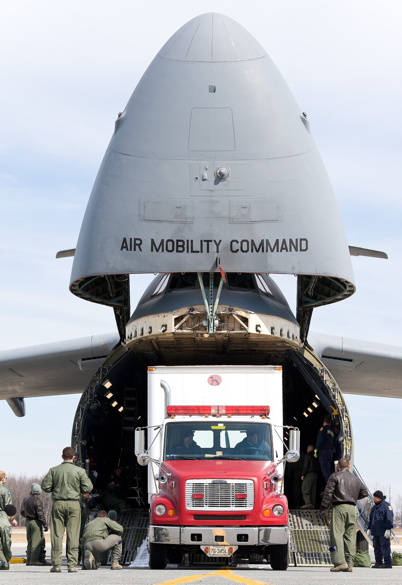 Jimmie Richards, Fairfax County Fire and Rescue Department, Va.: Virginia Task Force 1 driver/mechanic, backs up a Western Star Constellation truck attached to a 54-foot Great Dane trailer into the cargo compartment of a C-5M Super Galaxy March 3, 2016, on Dover Air Force Base, Del. Richards backed the truck and trailer weighing 92,000-pounds into the cargo compartment without a problem under the guidance of 9th Airlift Squadron loadmasters. (U.S. Air Force photo/Roland Balik)