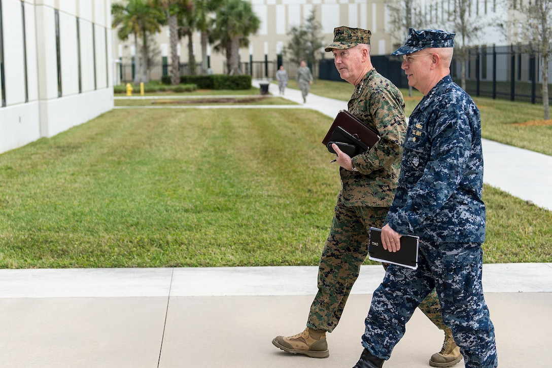 Marine Corps Gen. Joseph F. Dunford Jr., left, chairman of the Joint Chiefs of Staff, walks with Navy Adm. Kurt W. Tidd, commander, U.S. Southern Command, at the command's headquarters in Miami, March, 8, 2016. DoD photo by Navy Petty Officer 2nd Class Dominique A. Pineiro